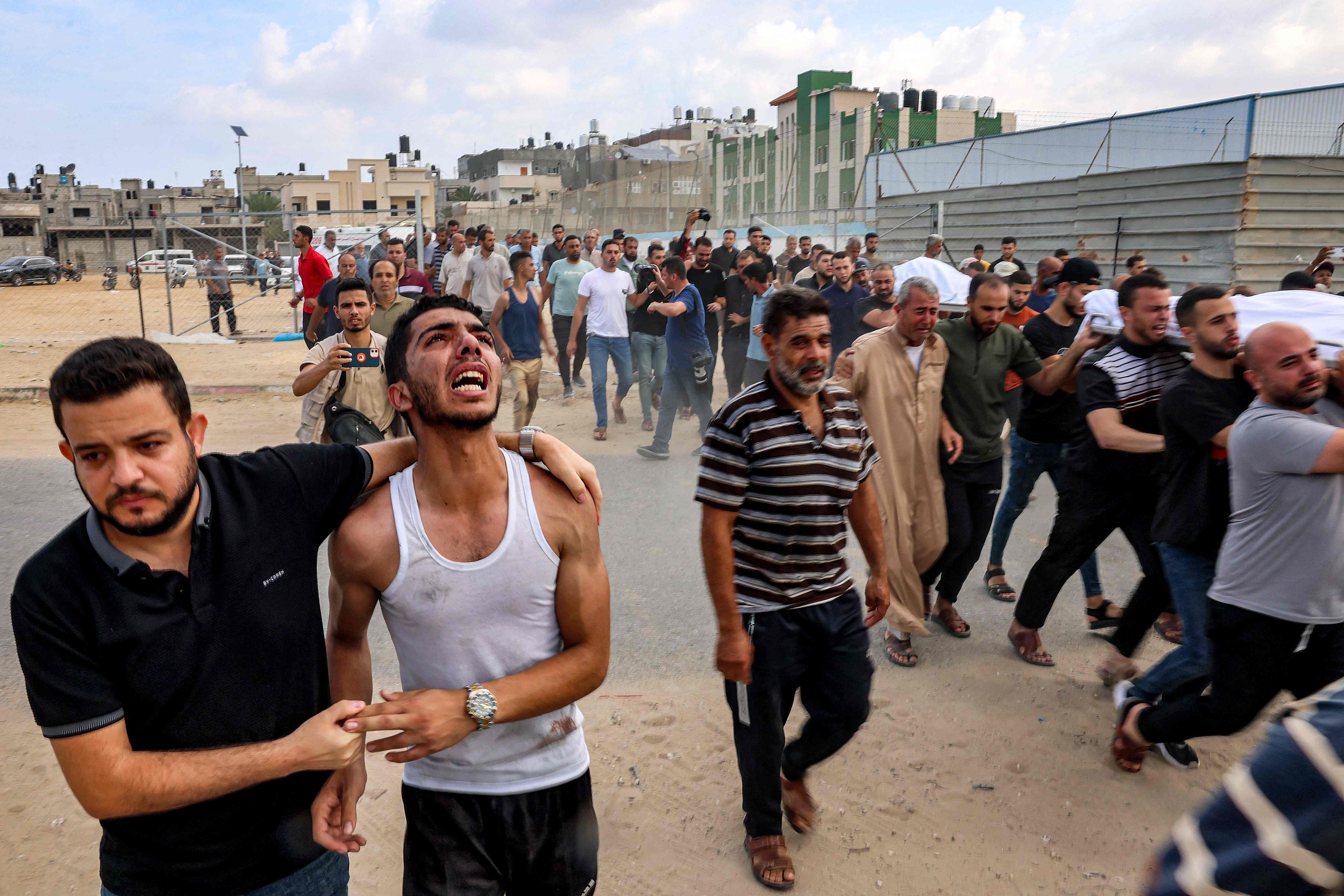 Mourners in Gaza carry the body of a family killed in an Israeli airstrike