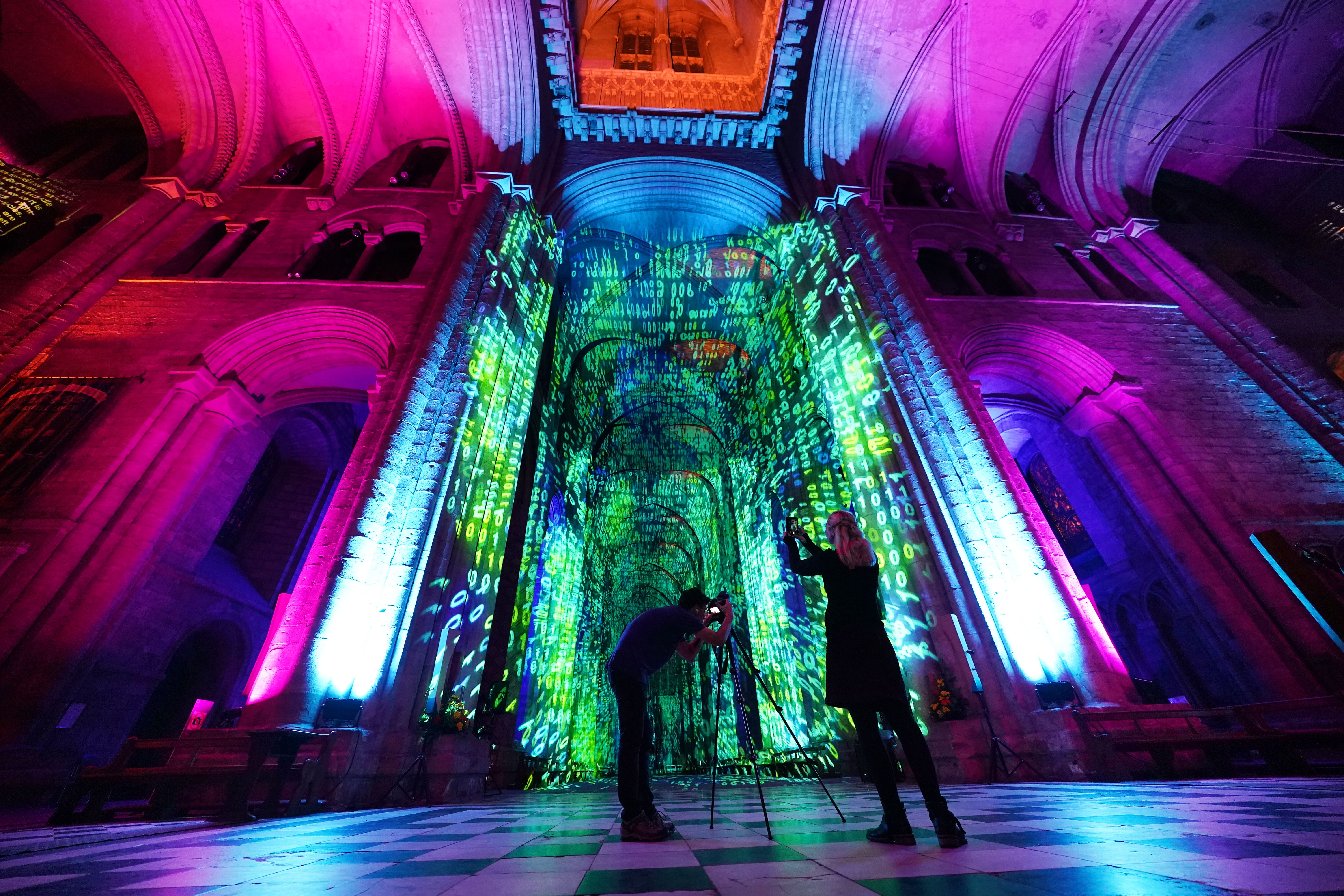 Durham Cathedral has been transformed for the new sound and light show inspired by science (Owen Humphreys/PA)