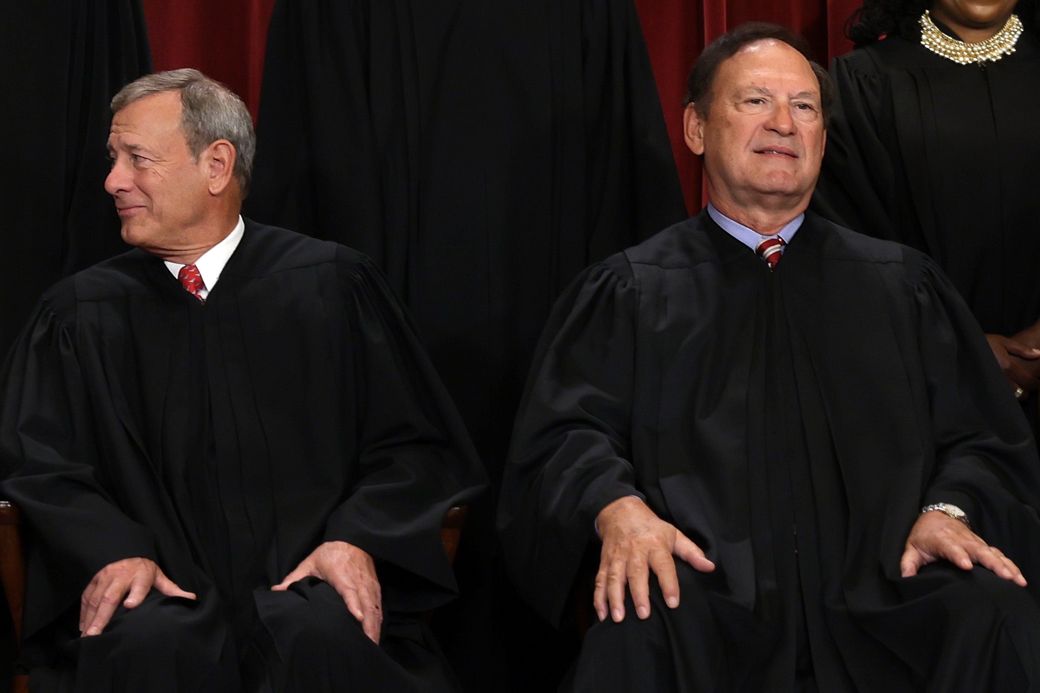 Chief Justice John Roberts, left, and associate Justice Samuel Alito, pictured in October 2022