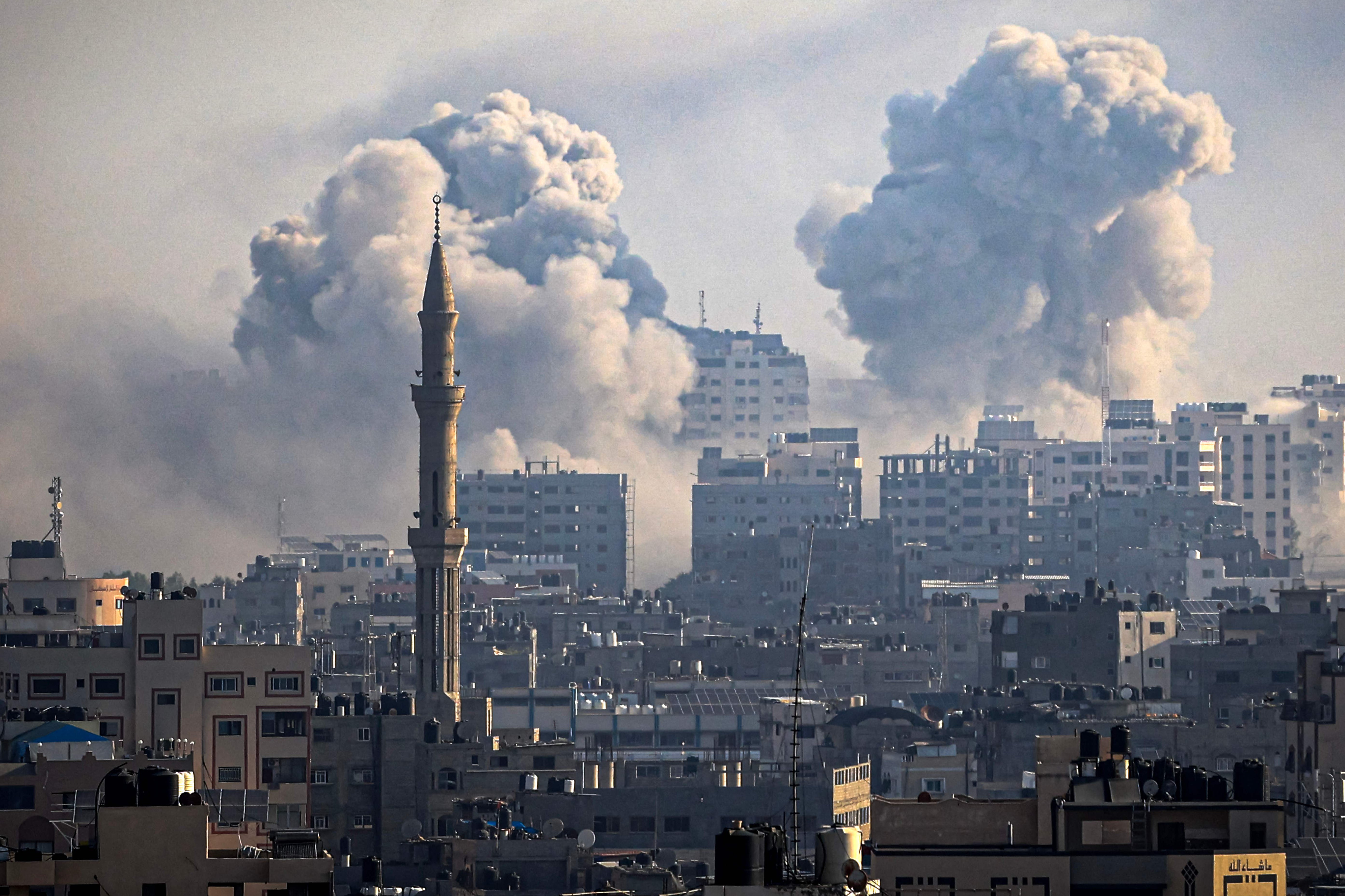 Smoke plumes billow during Israeli air strikes in Gaza City on Thursday