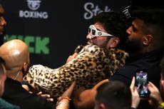 Dillon Danis hits Logan Paul in the head with microphone as face-off descends into chaos