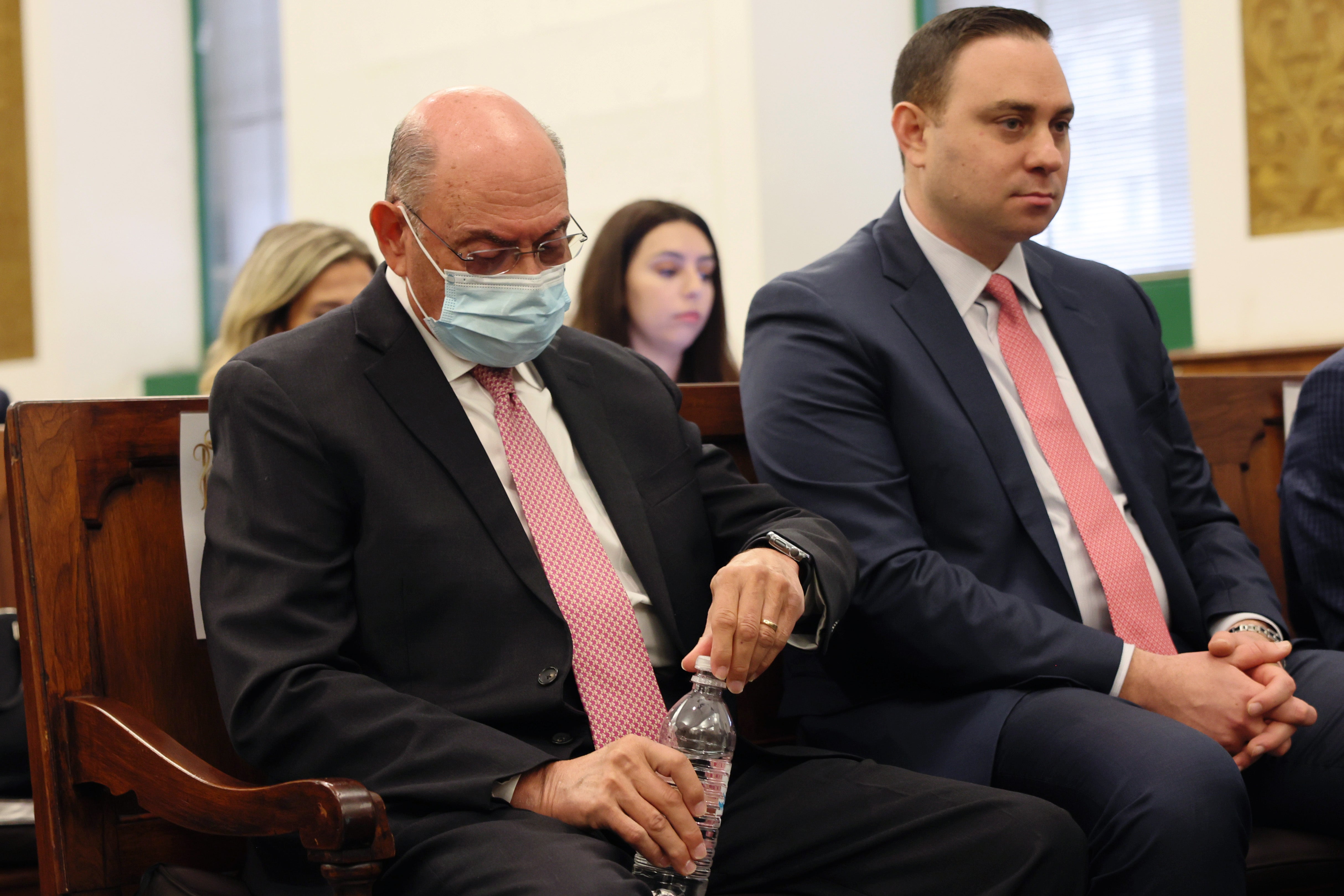 Former Trump Organization Executive Allen Weisselberg (L) sits in the courtroom during the civil fraud trial of former President Donald Trump