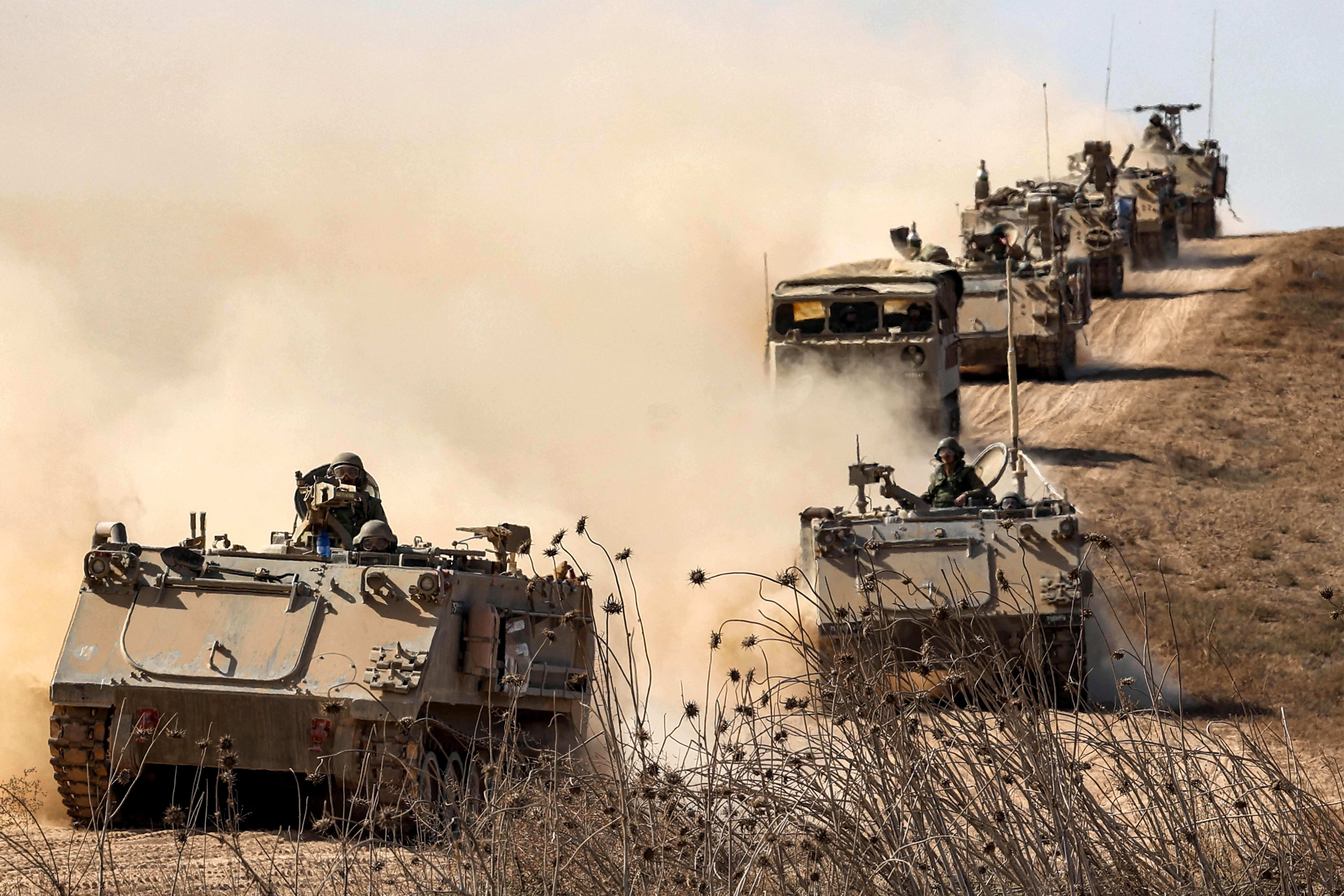 Israeli army infantry fighting vehicles (IFVs) deploy along the border with the Gaza Strip in southern Israel