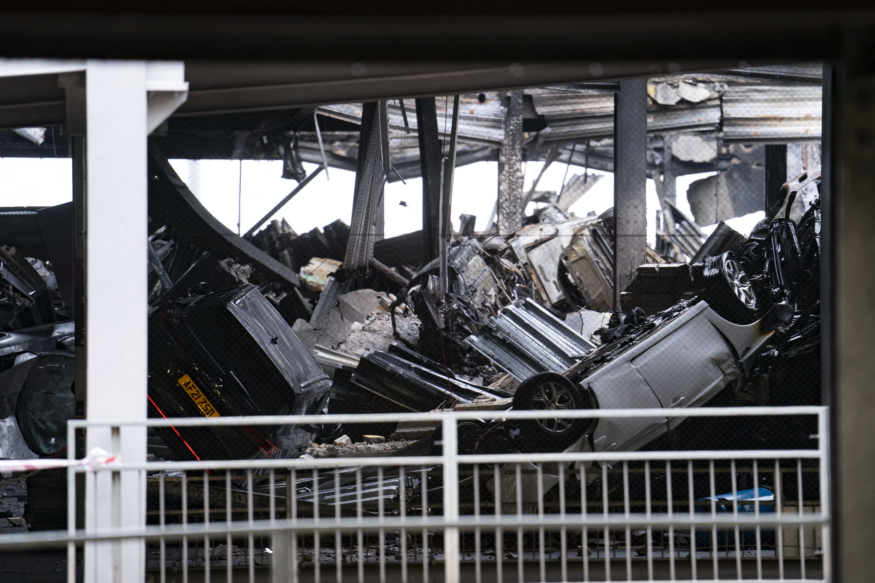 A car park at Luton Airport engulfed by fire earlier this week remains closed – with drivers with vehicles inside saying they have been offered ‘no help’ (PA)