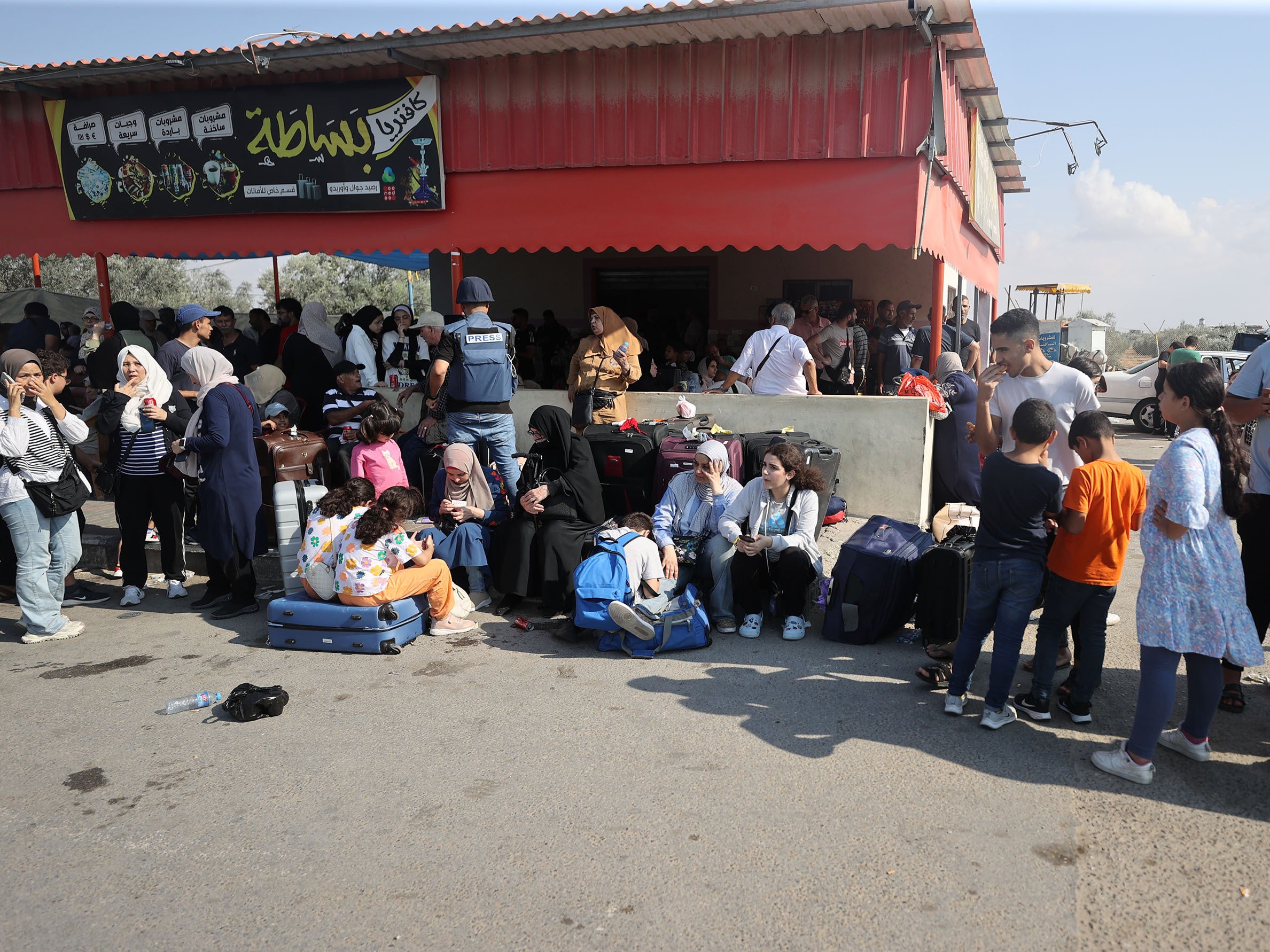 Gazans with foreign passports wait arrive the Rafah Border Gate and wait to cross into Egypt as Israel's attacks on the Gaza Strip continue on the eighth day in Rafah, Gaza on October 14, 2023