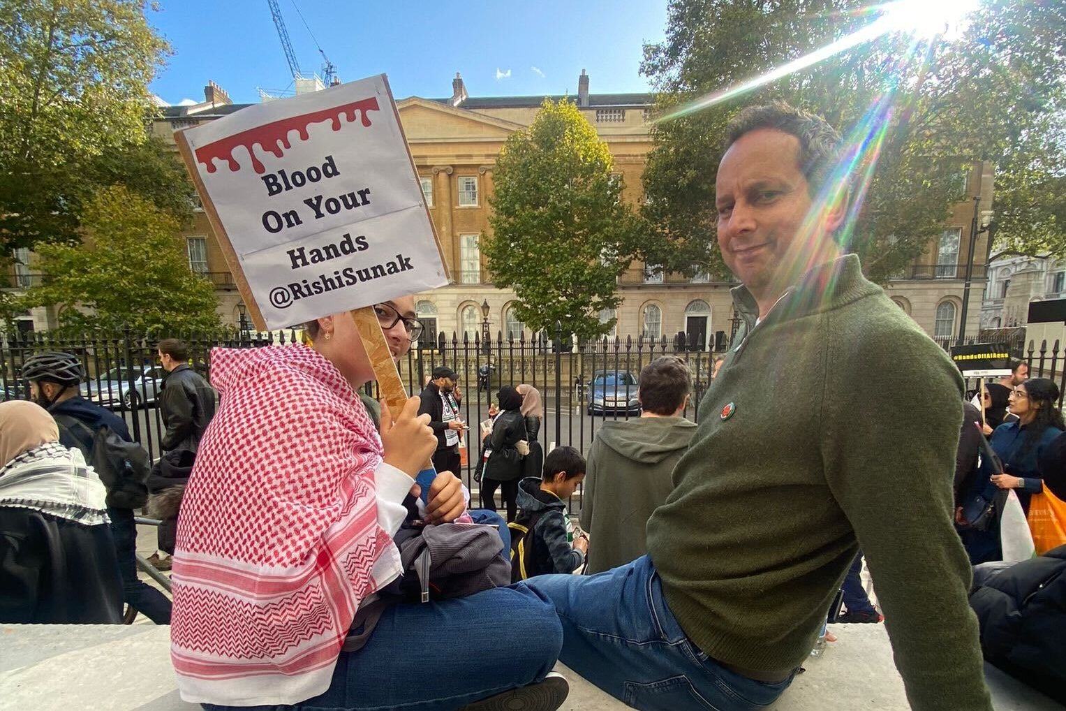 Hassan Kamal, a British Palestinian from Jerusalem, with his daughter at the march in London