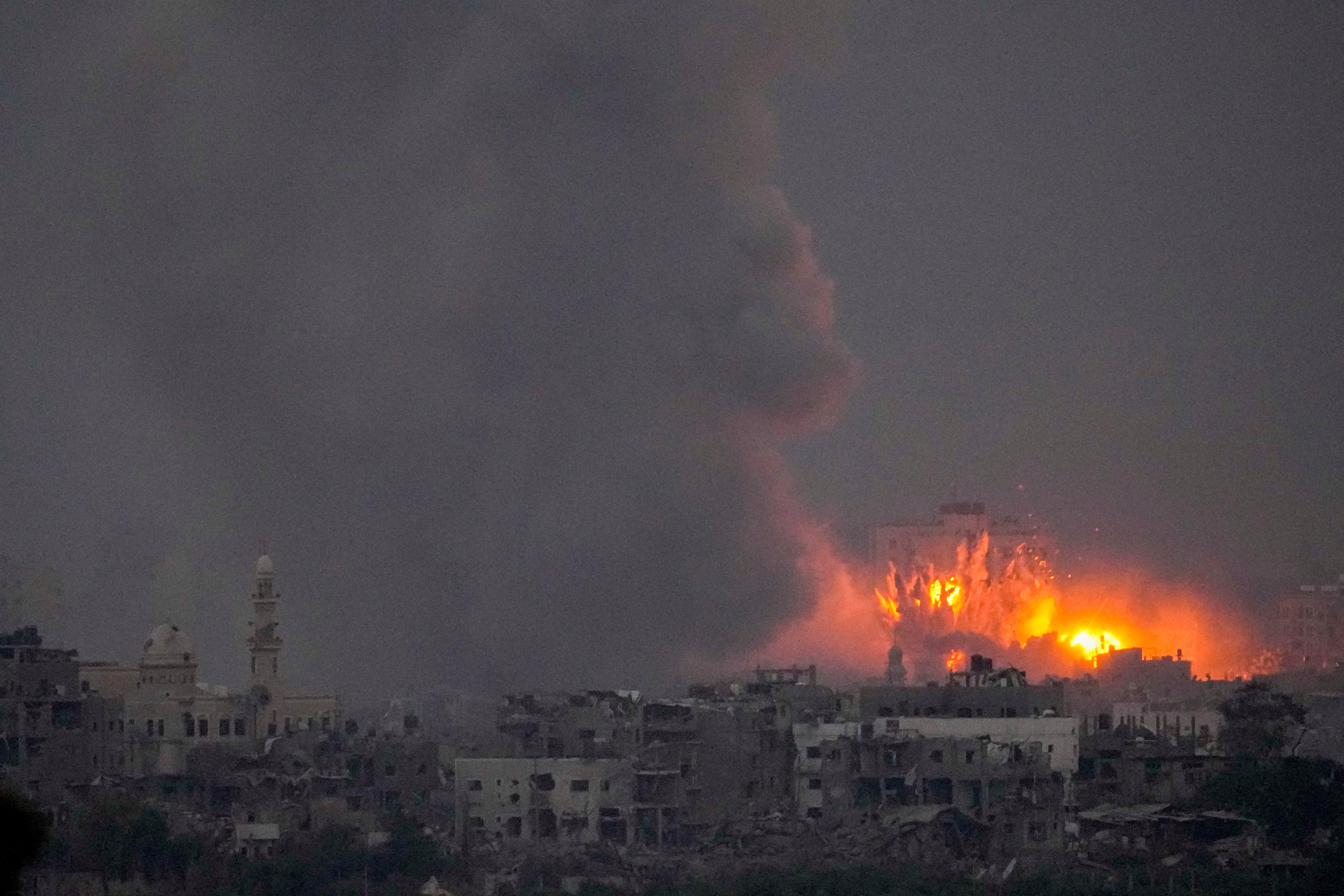 Smoke and fire rise following an Israeli airstrike in the Gaza Strip, as seen from southern Israel, Saturday, Oct. 14, 2023.