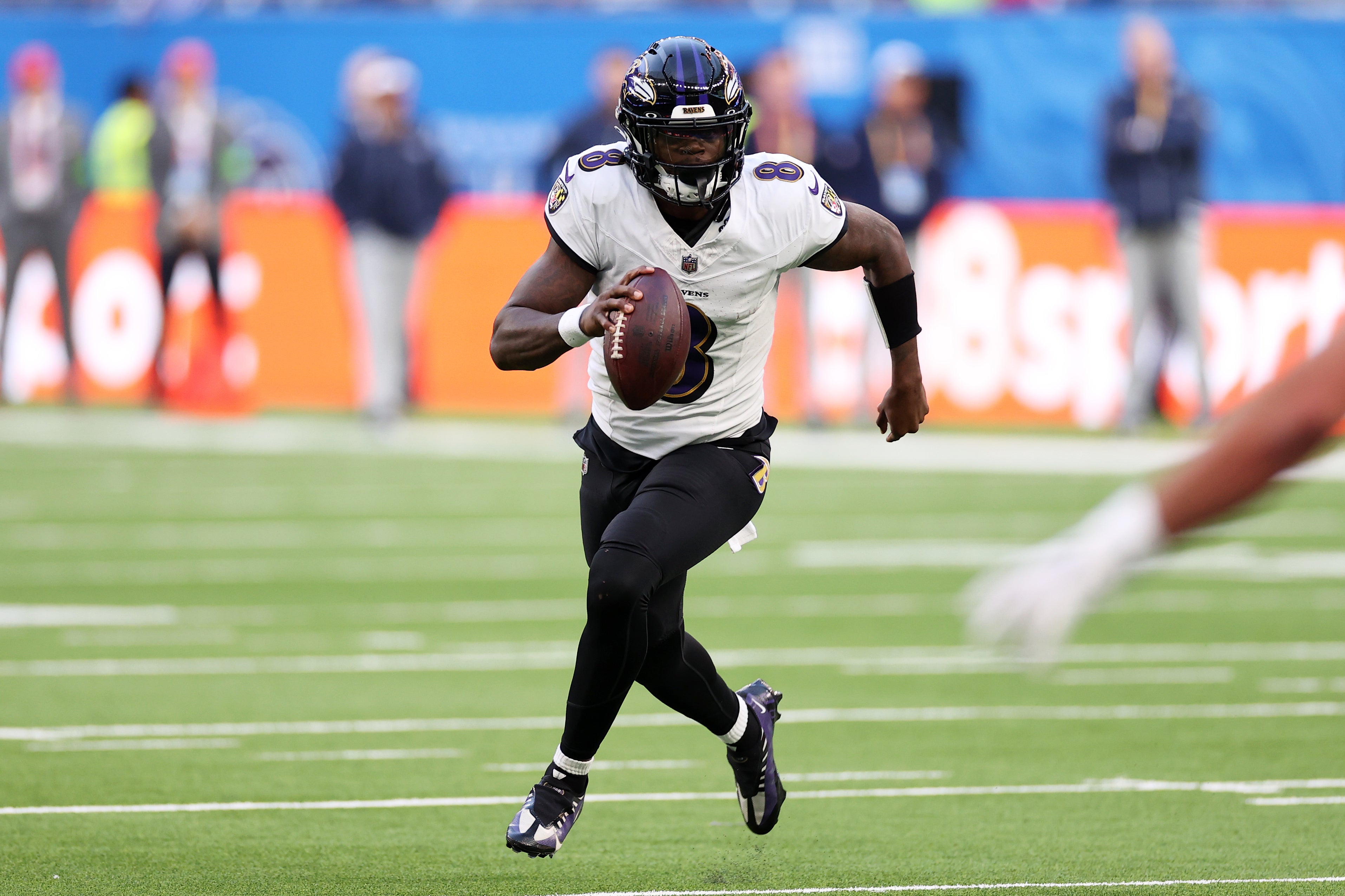 Lamar Jackson #8 of the Baltimore Ravens looks to pass