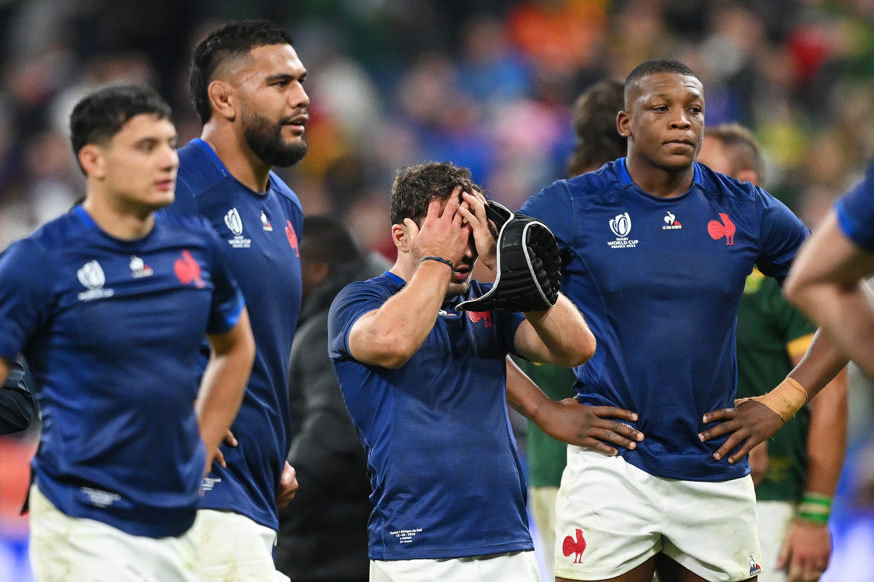 French players react after their dramatic defeat in Paris