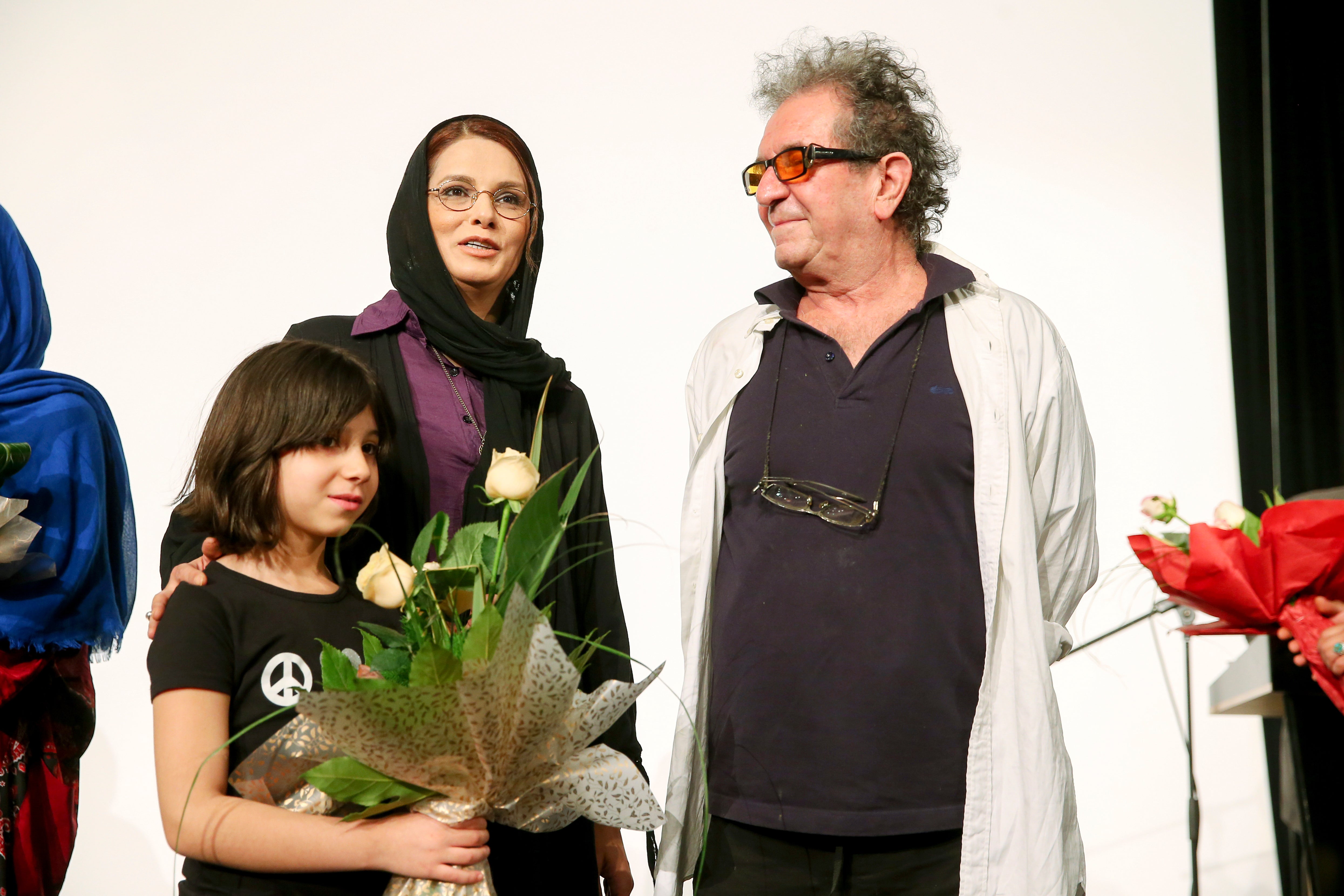 File Dariush Mehrjui and his wife and their daughter Mona stand on stage during a private movie screening in Tehran, Iran in 2013