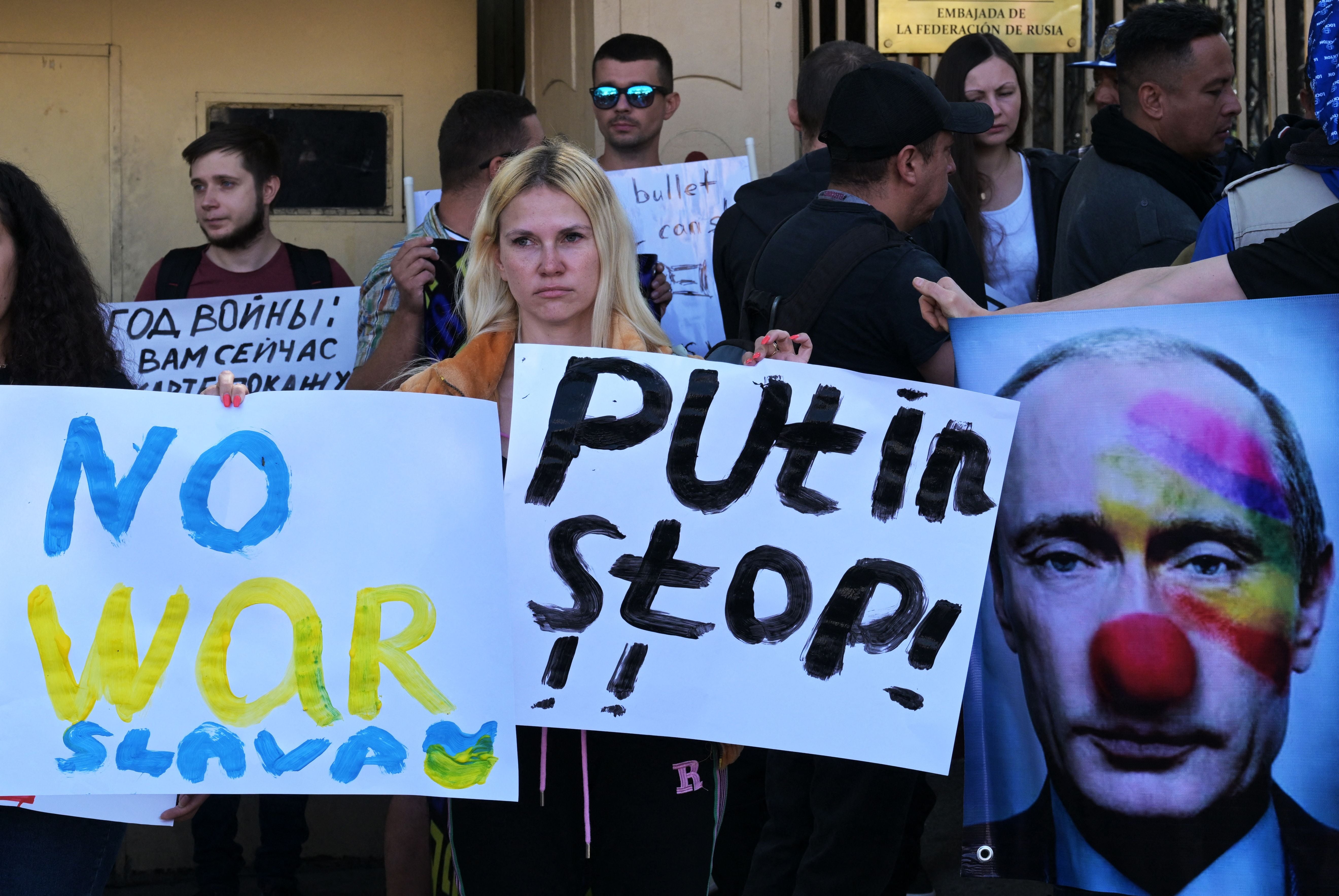 Russian citizens take part in a protest against the war and Russian President Vladimir Putin, in front of the Russian embassy in Mexico