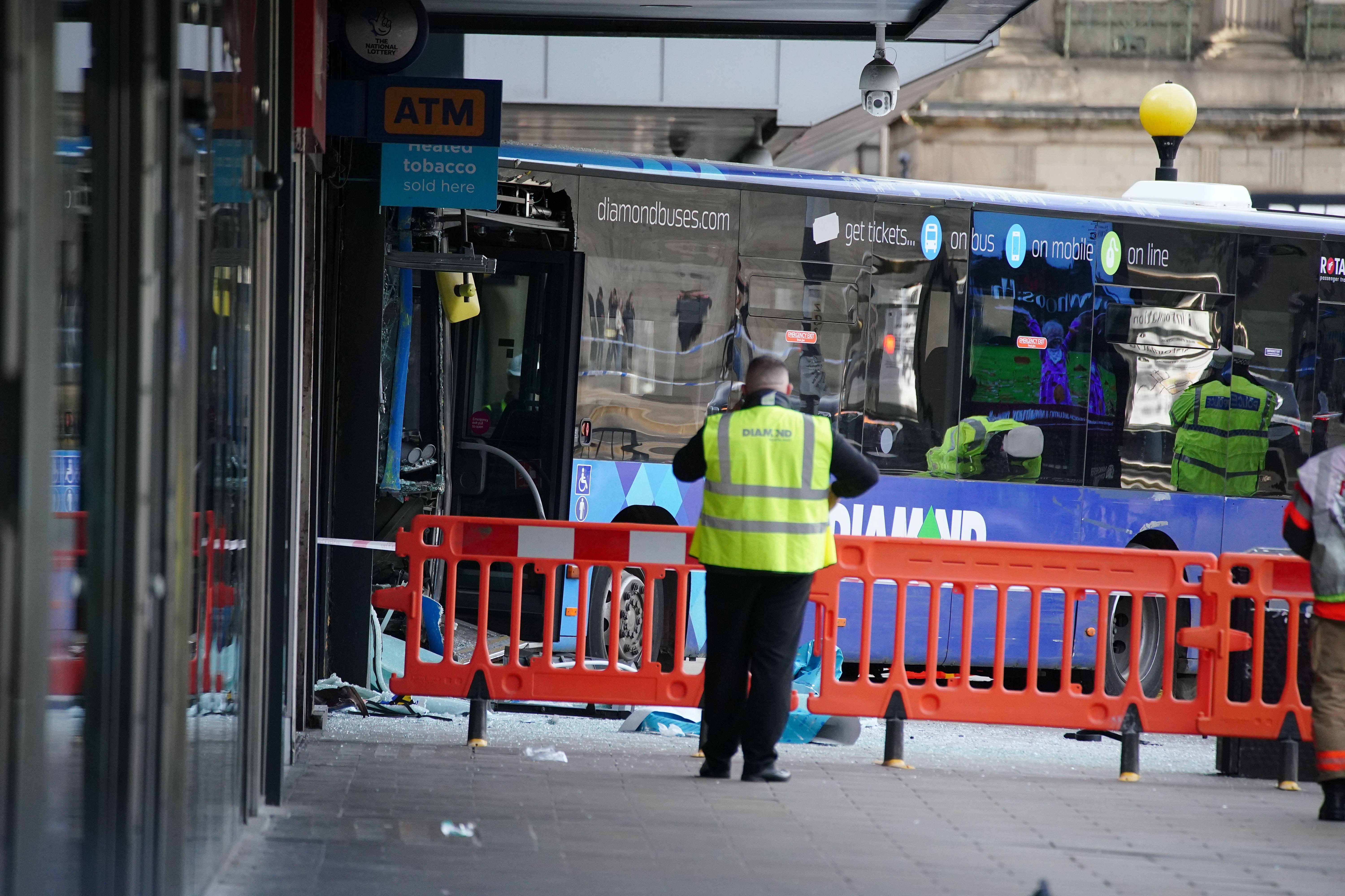 Emergency services at the scene of a bus crash at the City Tower building close to Manchester’s Piccadilly Gardens Metrolink stop. Picture date: Monday October 16, 2023. (Peter Byrne/PA)