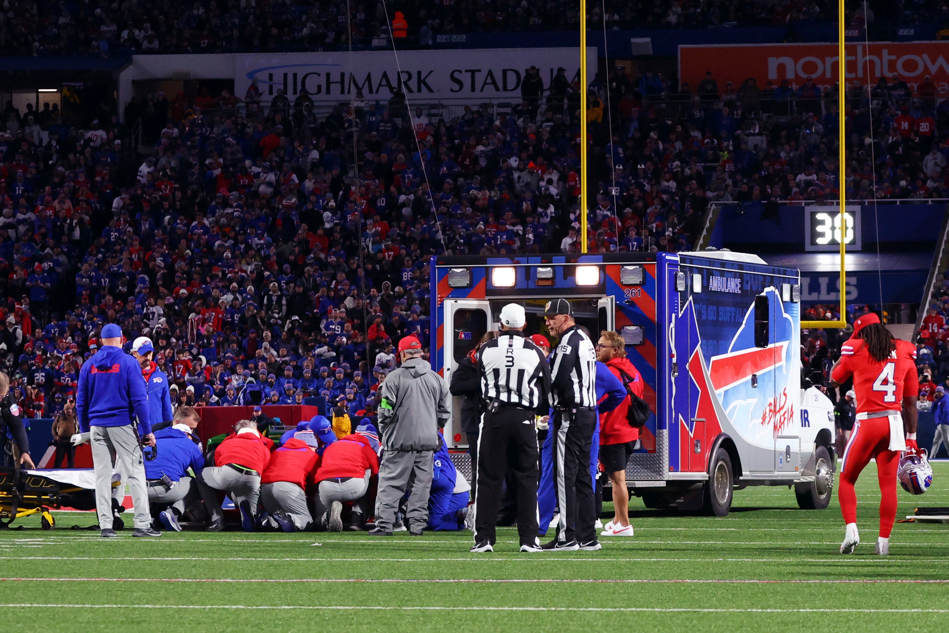 An ambulance waits on the field as medical staff attend to Buffalo Bills running back Damien Harris during the first half of an NFL football game against the New York Giants in Orchard Park, N.Y., Sunday Oct. 15, 2023.