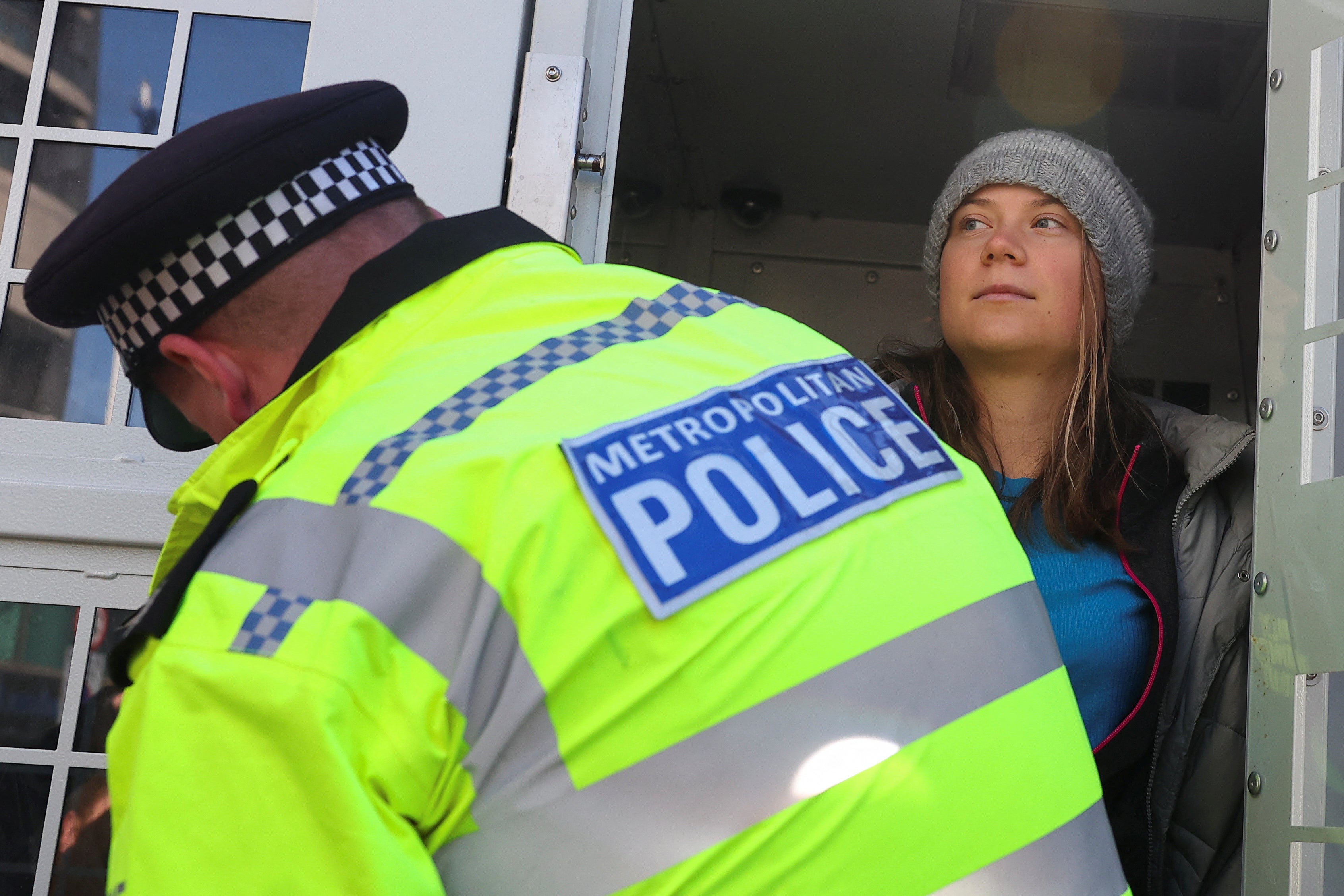 The climate activist was pictured standing inside a police van in Mayfair