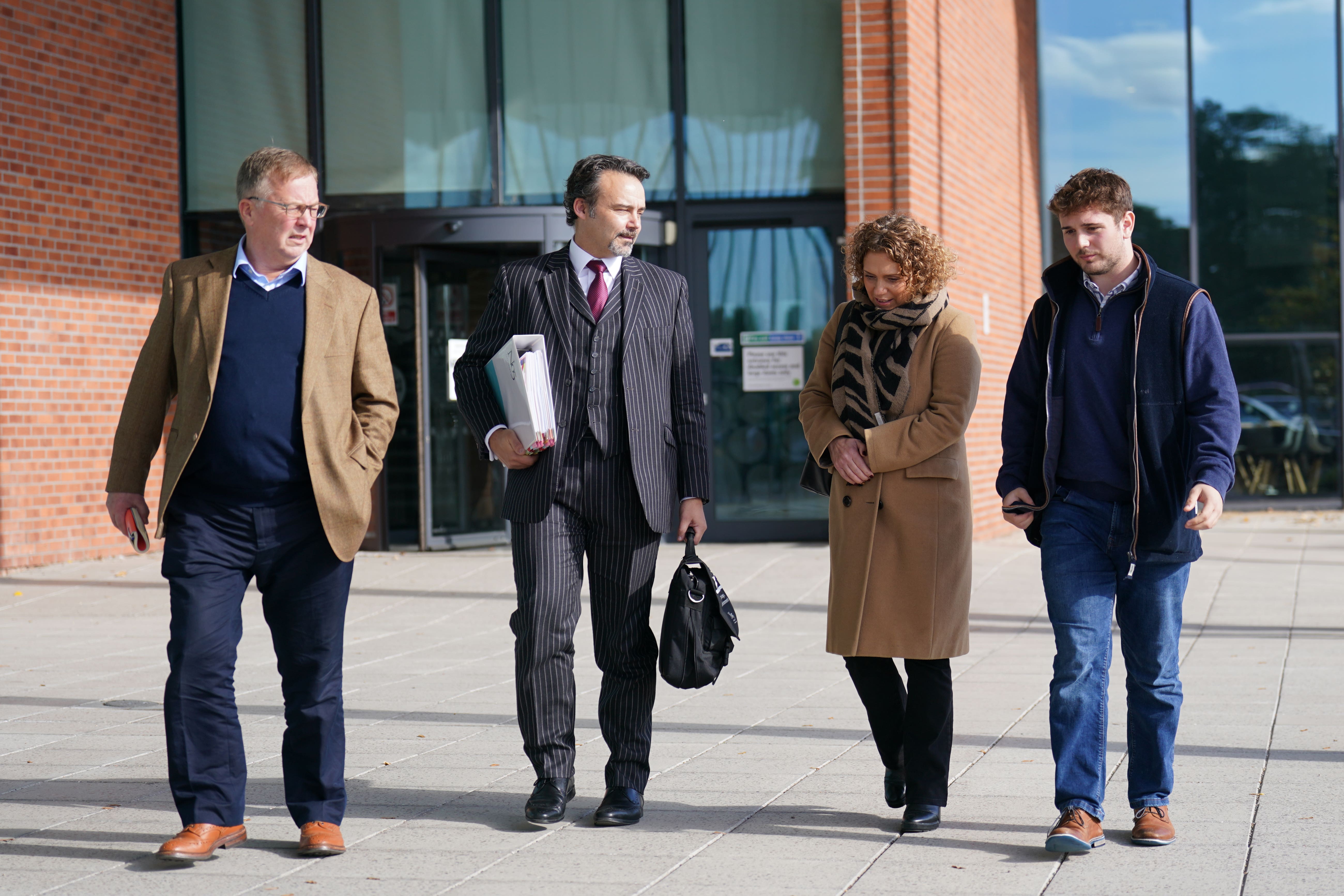 Hannah Ingram-Moore attended an appeal hearing against the demolition of a spa pool block at her home, with husband Colin (far left) and son Benji (right)