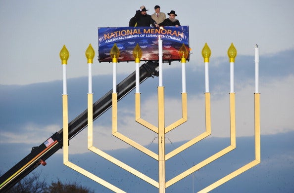 Rabbi Levi Shemtov, Washington Director, American Friends of Lubavitch; White Houe Budget Director Jacob Lew and Rabbi Abraham Shemtov, Director, American Friends of Lubavitch, take part in the annual national Hanukkah menorah lighting ceremony at the White House Ellipse December 01, 2010