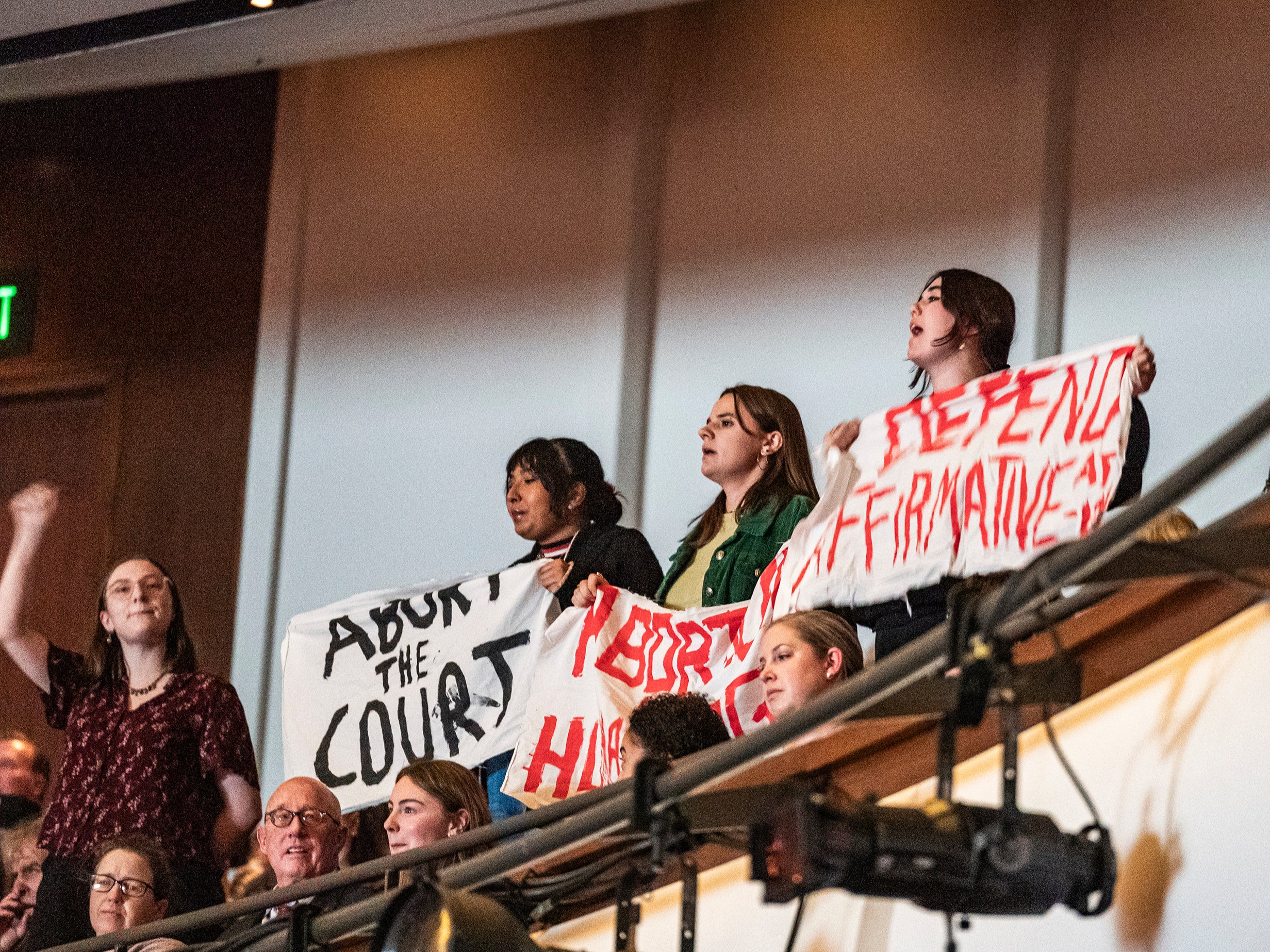 Protesters interrupt the session as U.S. Supreme Court Justice Amy Coney Barrett speaks with Professor Robert A. Stein at Northrop Auditorium as part of the Stein Lecture Series in Minneapolis, Monday, Oct. 16, 2023.