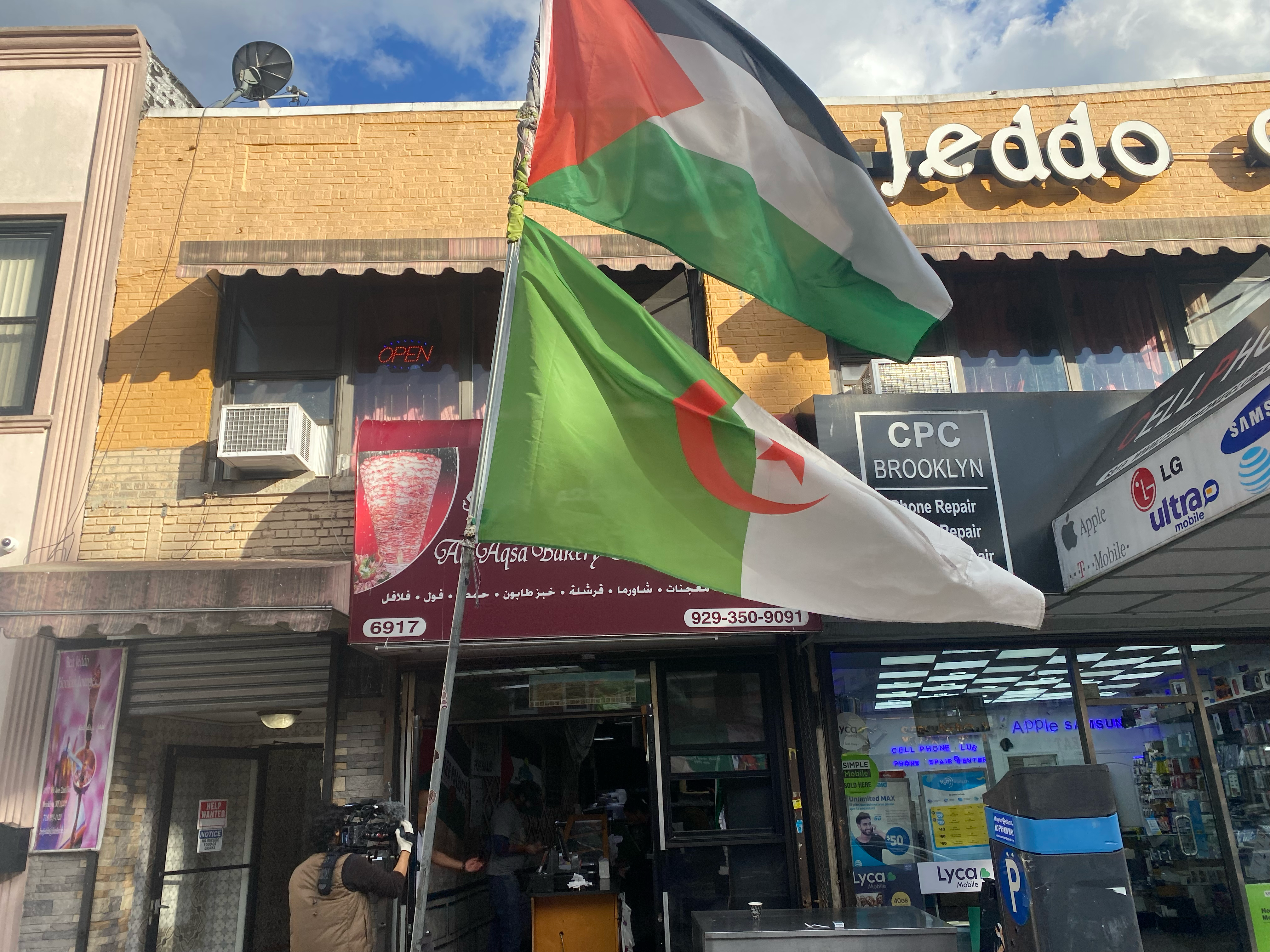 A Palestinian flag flies outside of the Al Aqsa bakery and restaurant in Bay Ridge, Brooklyn