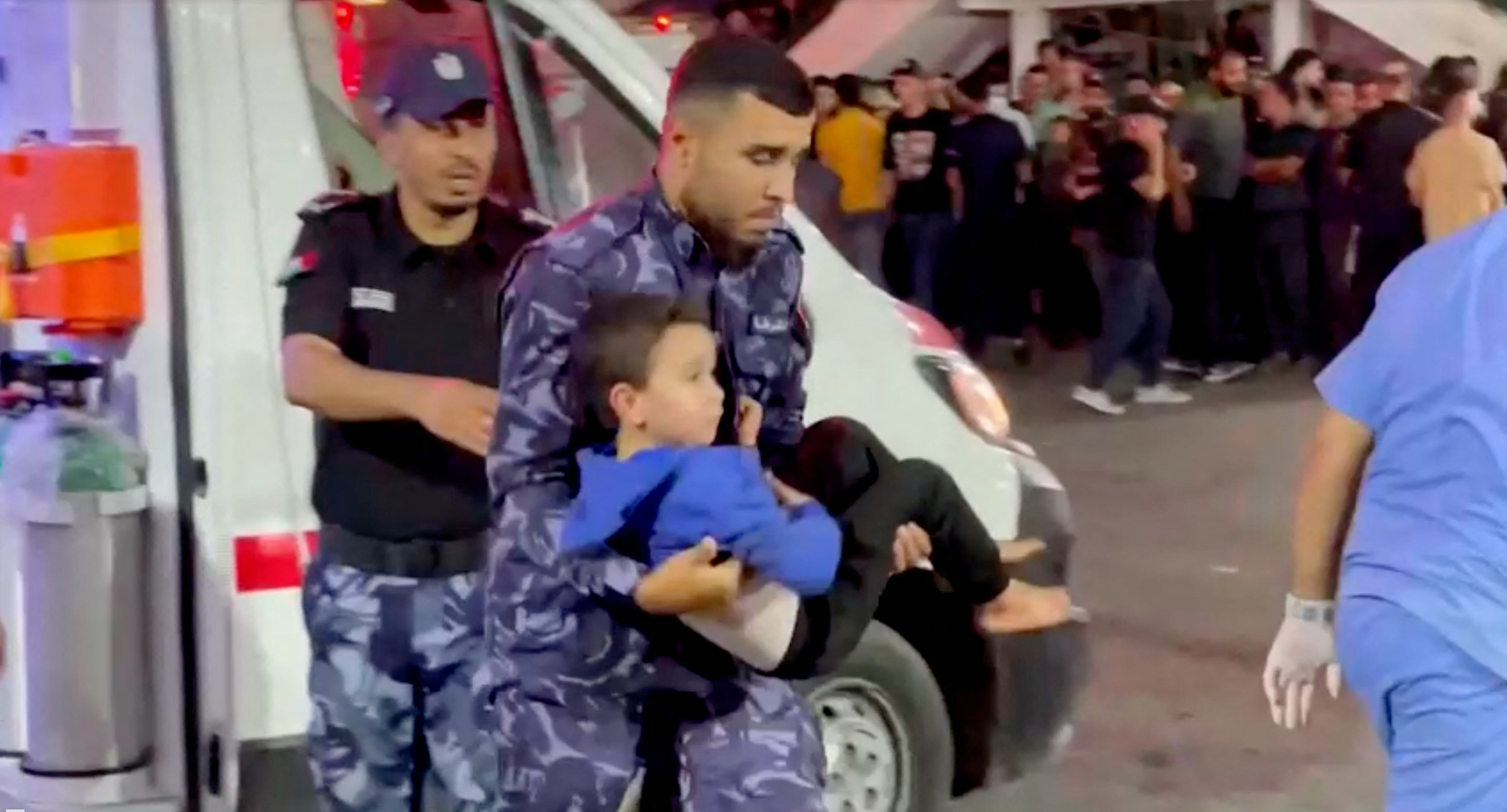 An Injured child is taken into a hospital after Israeli air strike hit a hospital