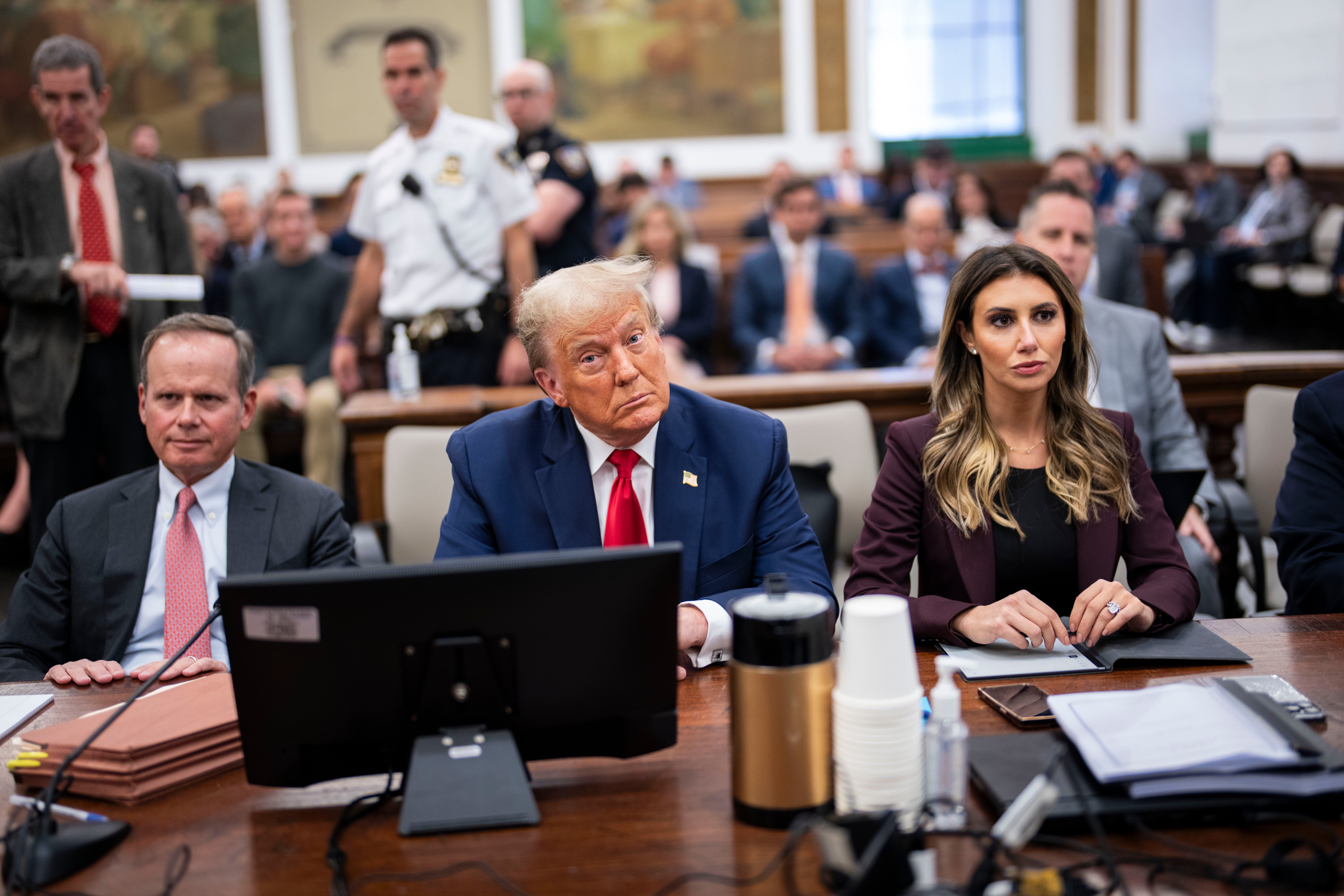 Donald Trump appears with his attorneys Christopher Kise, left, and Alina Habba, right, in New York Superior Court on 17 October.