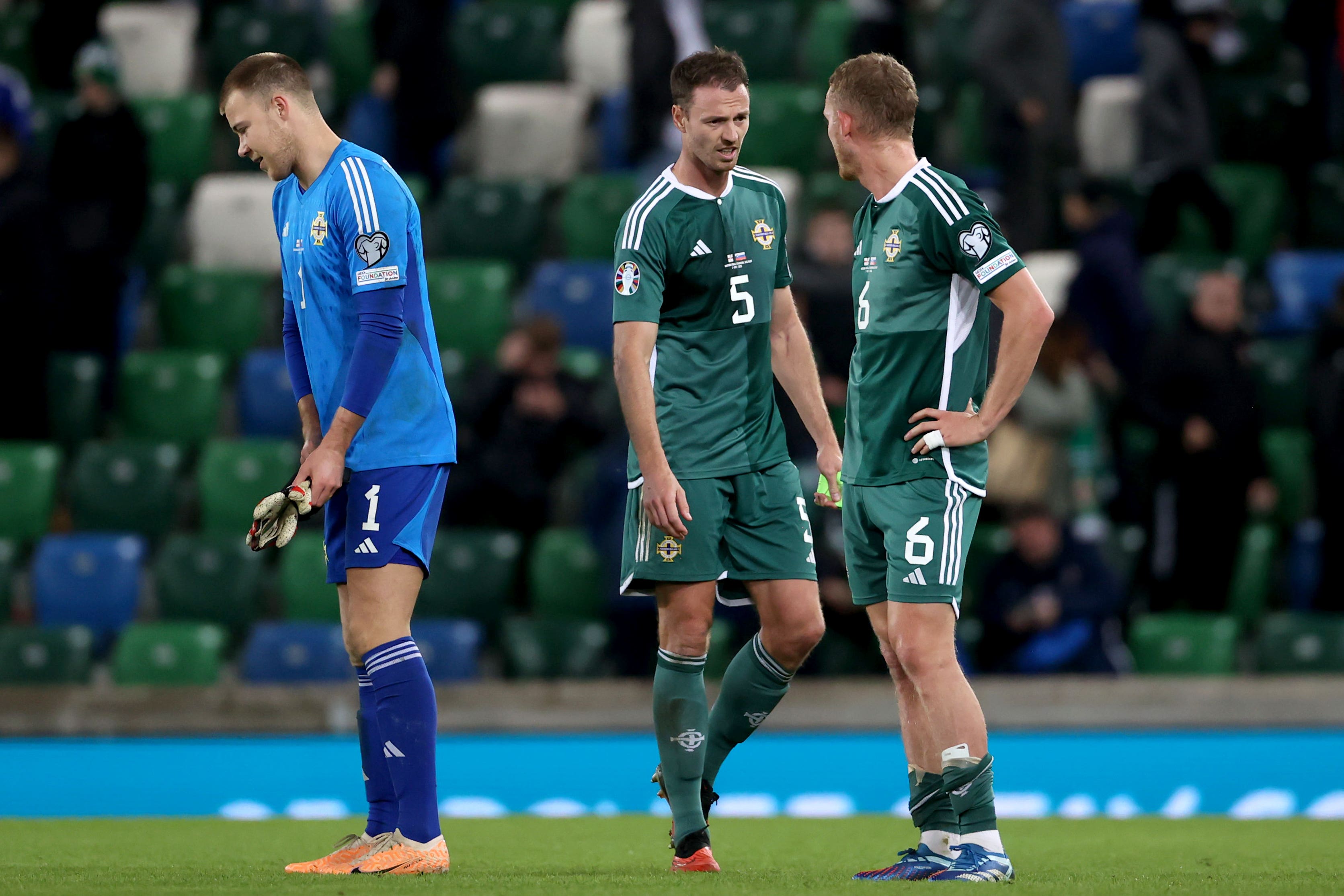 Northern Ireland’s Jonny Evans (centre), George Saville and goalkeeper Bailey Peacock-Farrell (left) were disappointed (PA)