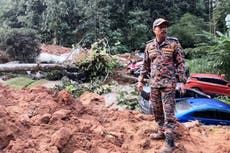 Malaysia says landslide that killed 31 people last year was caused by heavy rain, not human activity