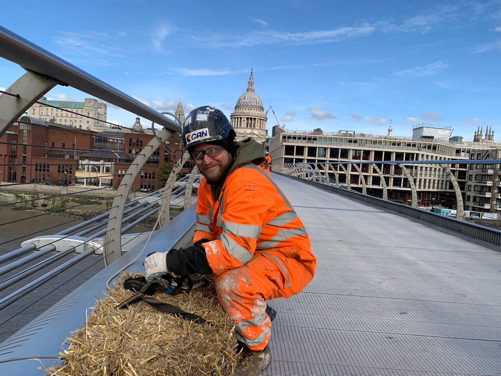 The bale of straw (not to be confused with hay) has travelled from Button Farm in Essex to London to be suspended