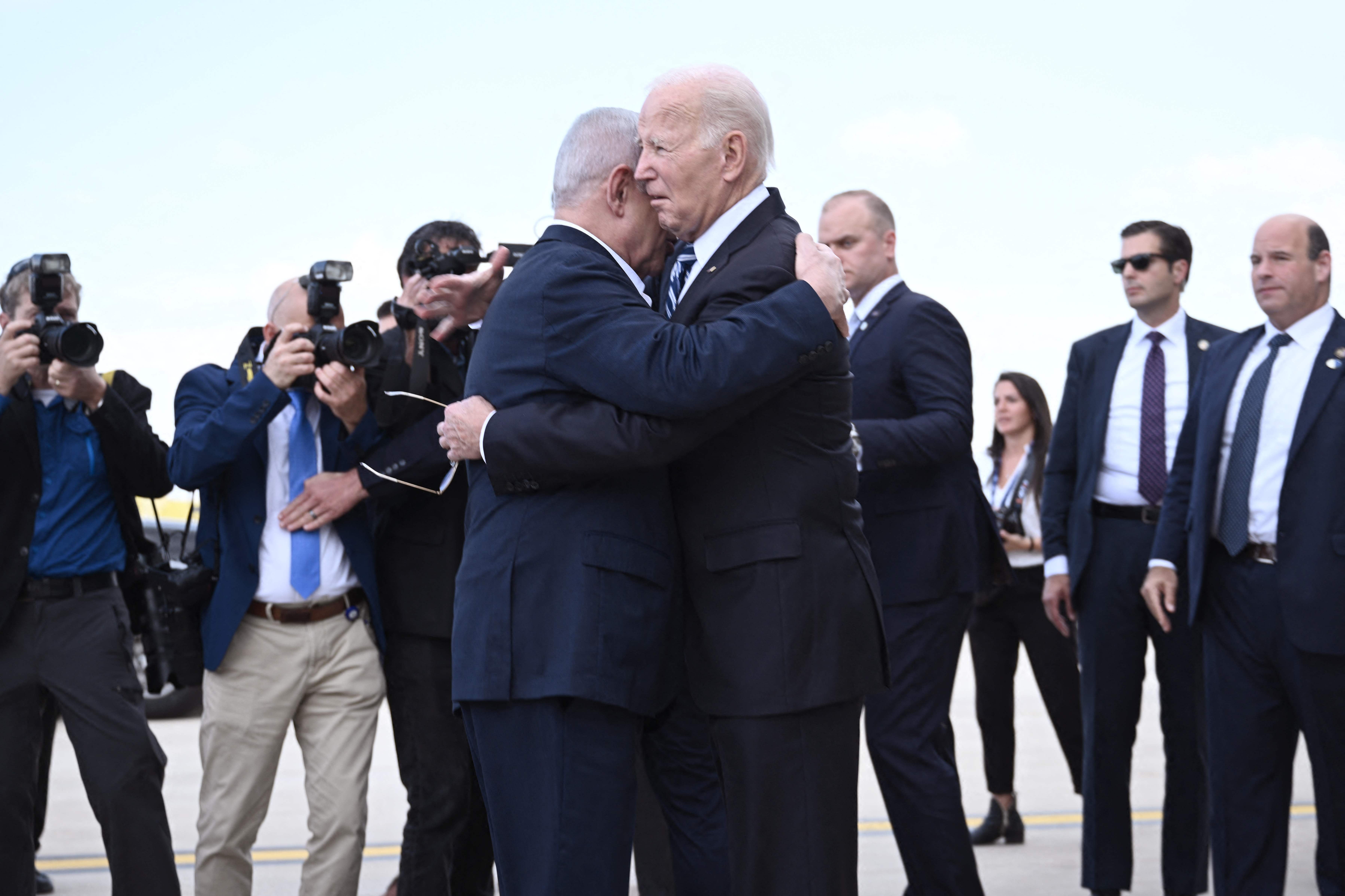 Biden and Netanyahu embrace on the tarmac in Tel Aviv