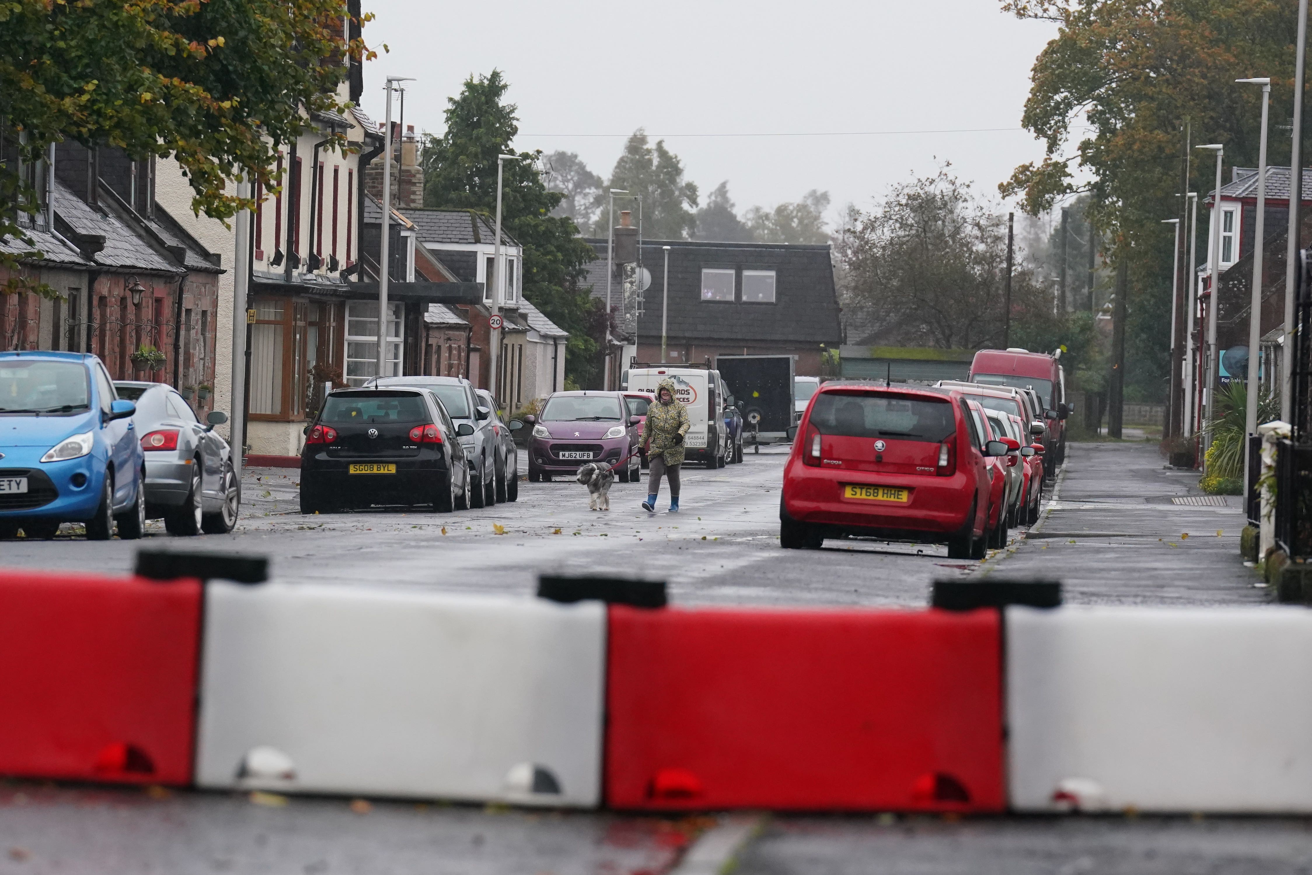 Parts of the UK could be cut off by flooding as Storm Babet batters the country, with a rare red weather warning issued for Scotland (Andrew Milligan/PA)