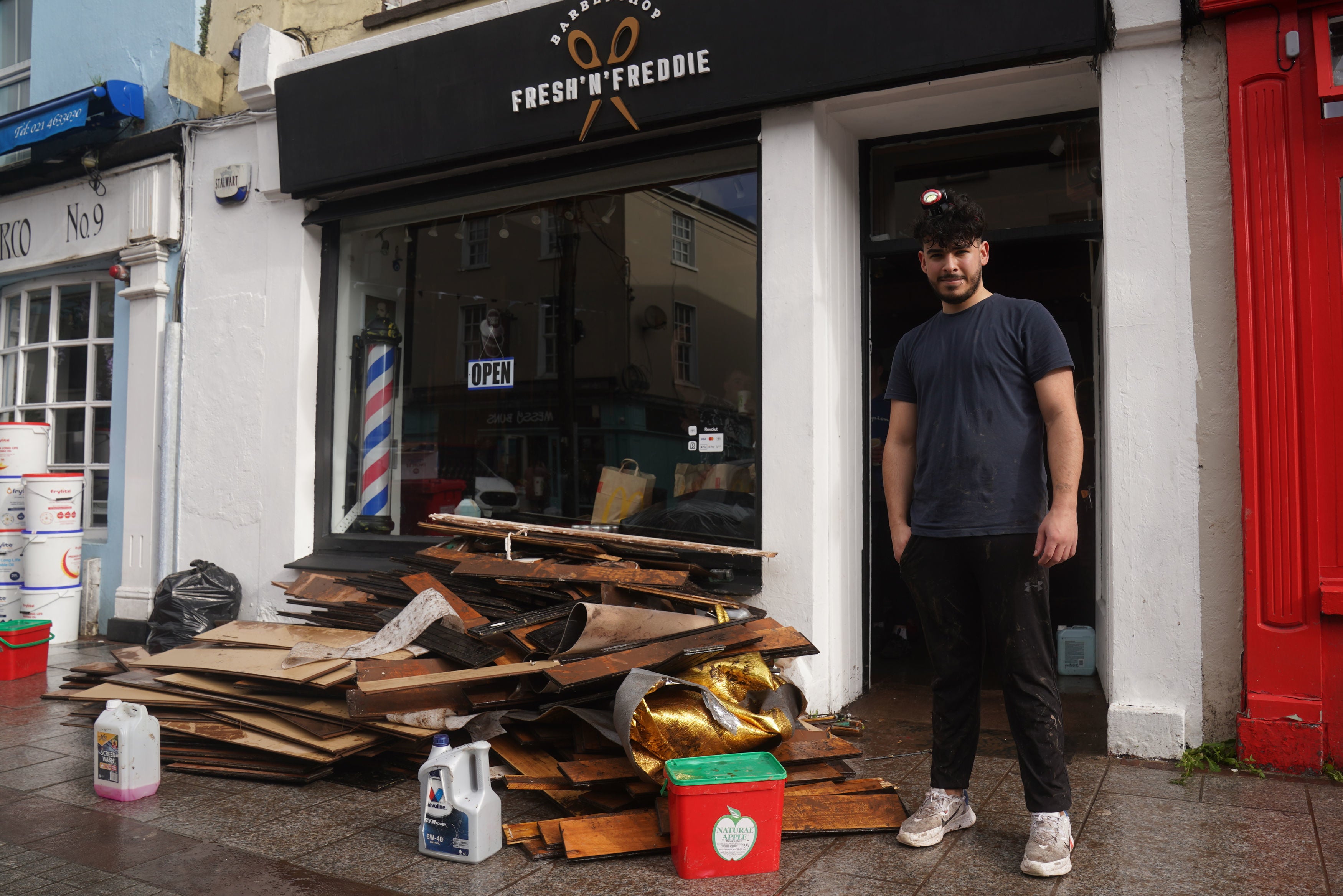 Firat Freddie Uygun outside his barber shop Fresh 'N' Freddie