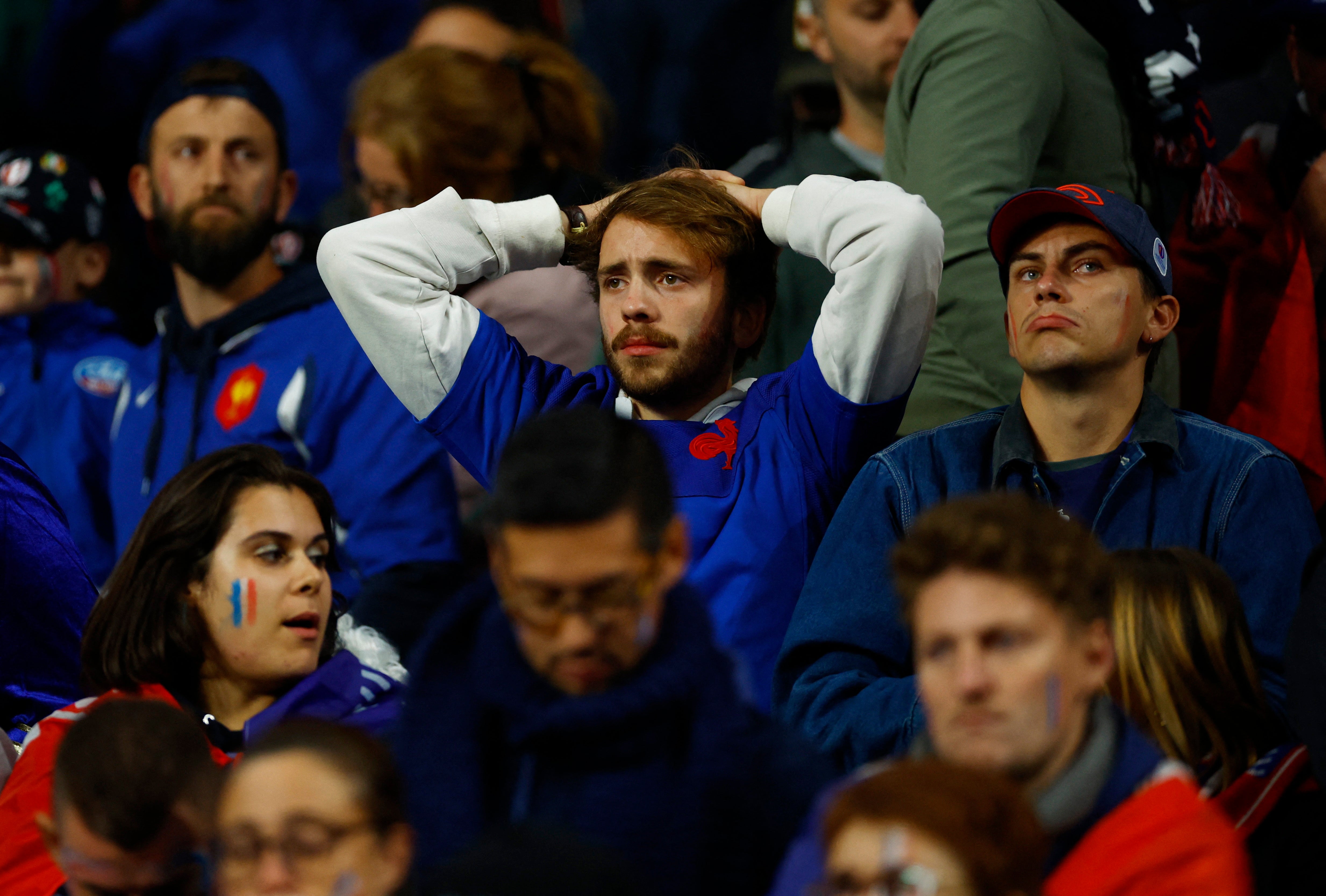 France fans look dejected after defeat to South Africa