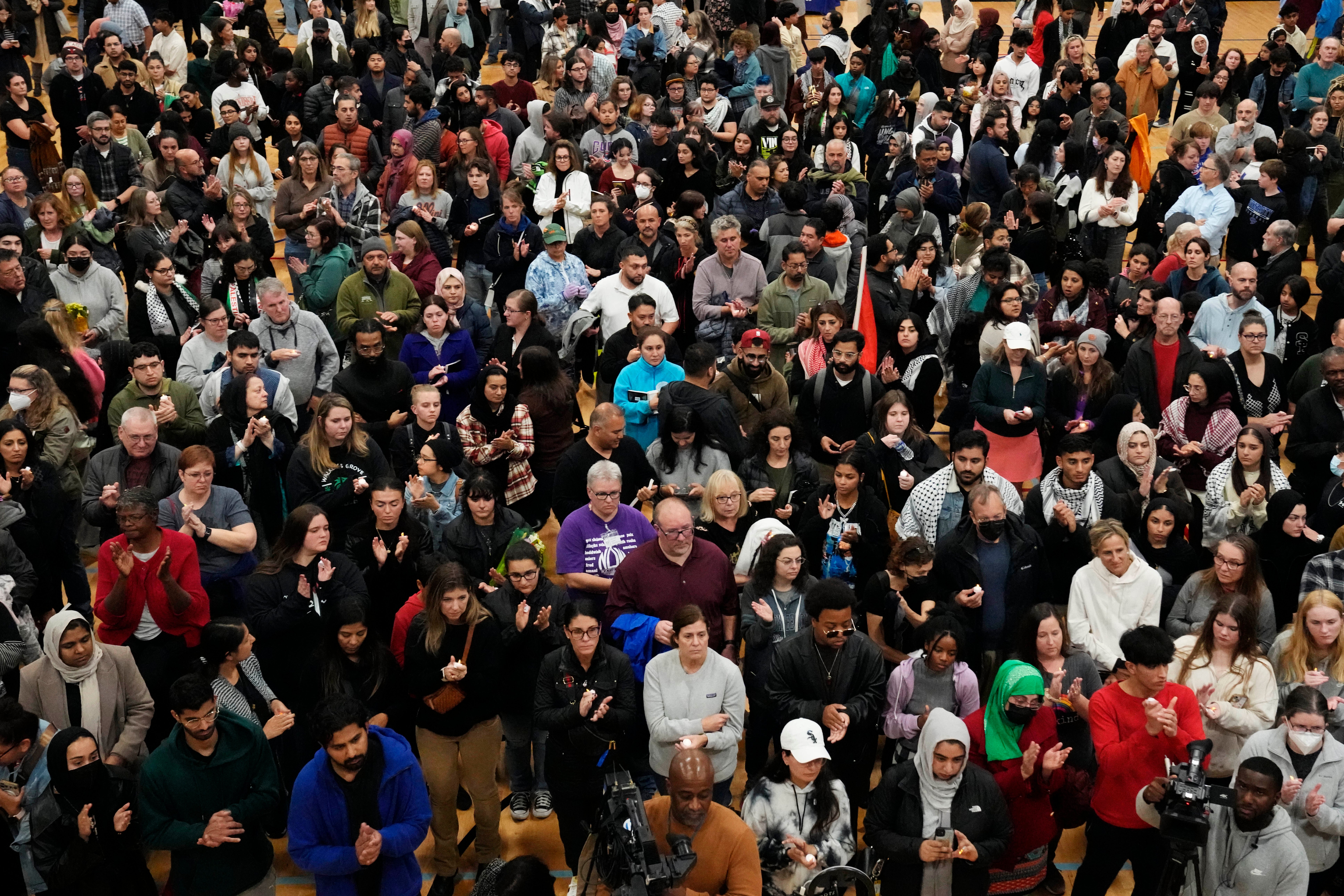 People gather at the funeral of Wadea Al-Fayoume