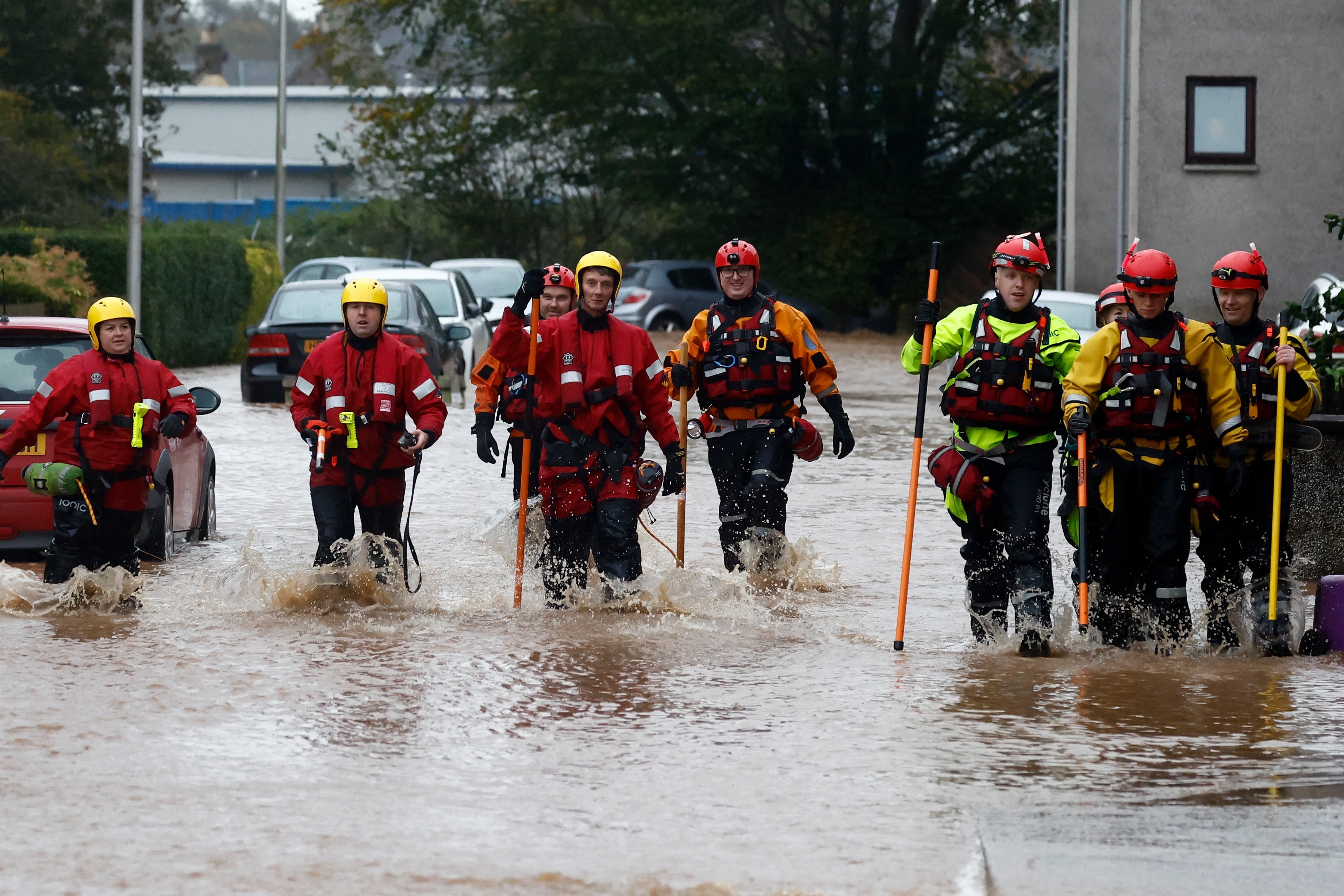 A rescue team wades through flood waters in Brechin where people were told to leave their homes