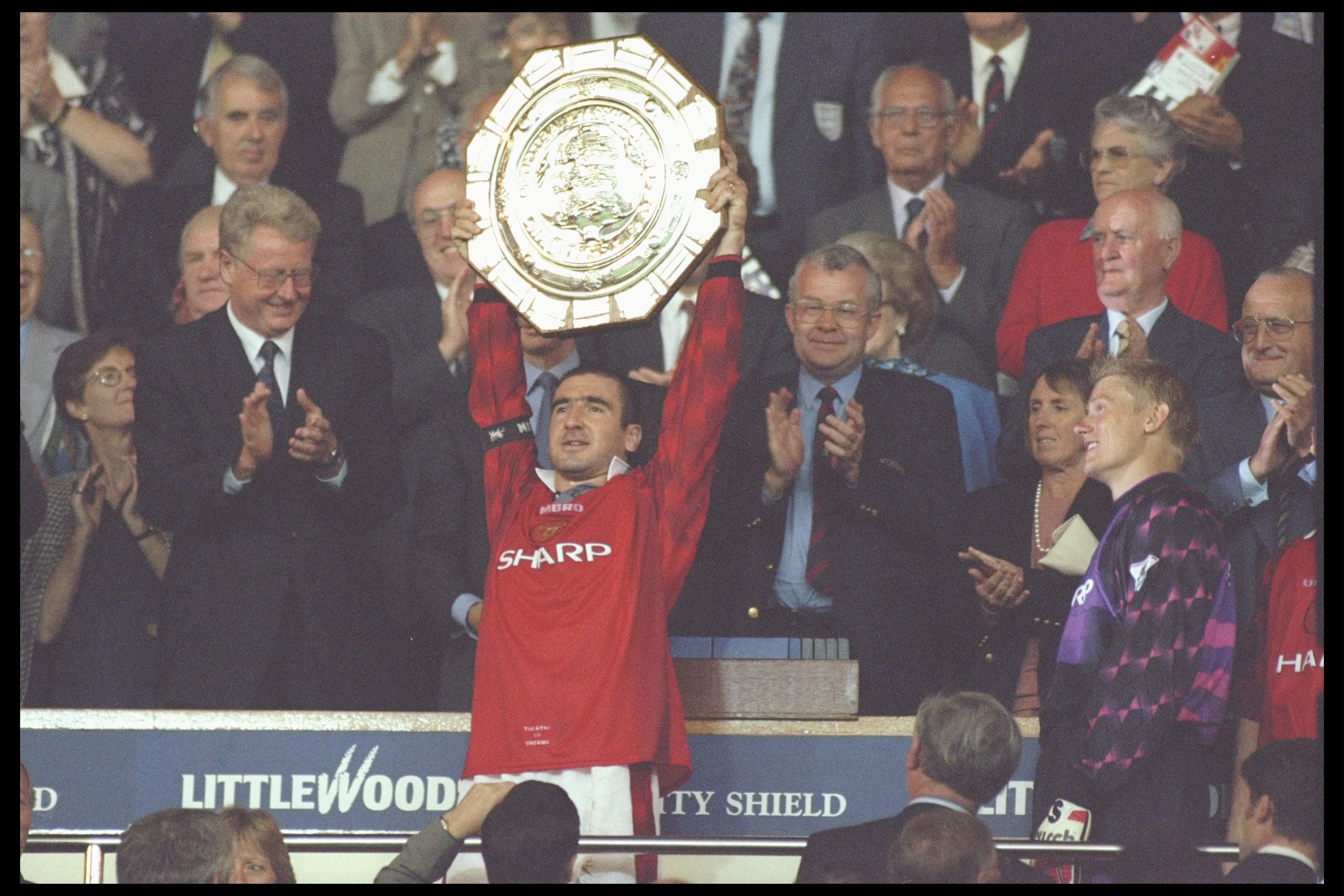 Cantona holds aloft the Charity shield after Manchester United’s victory against Newcastle United at Wembley Stadium, 11 August 1996