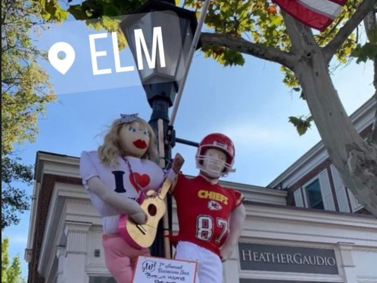 Scarecrow versions of Taylor Swift and Travis Kelce hanging outside Elm restaurant in New Canaan, Connecticut