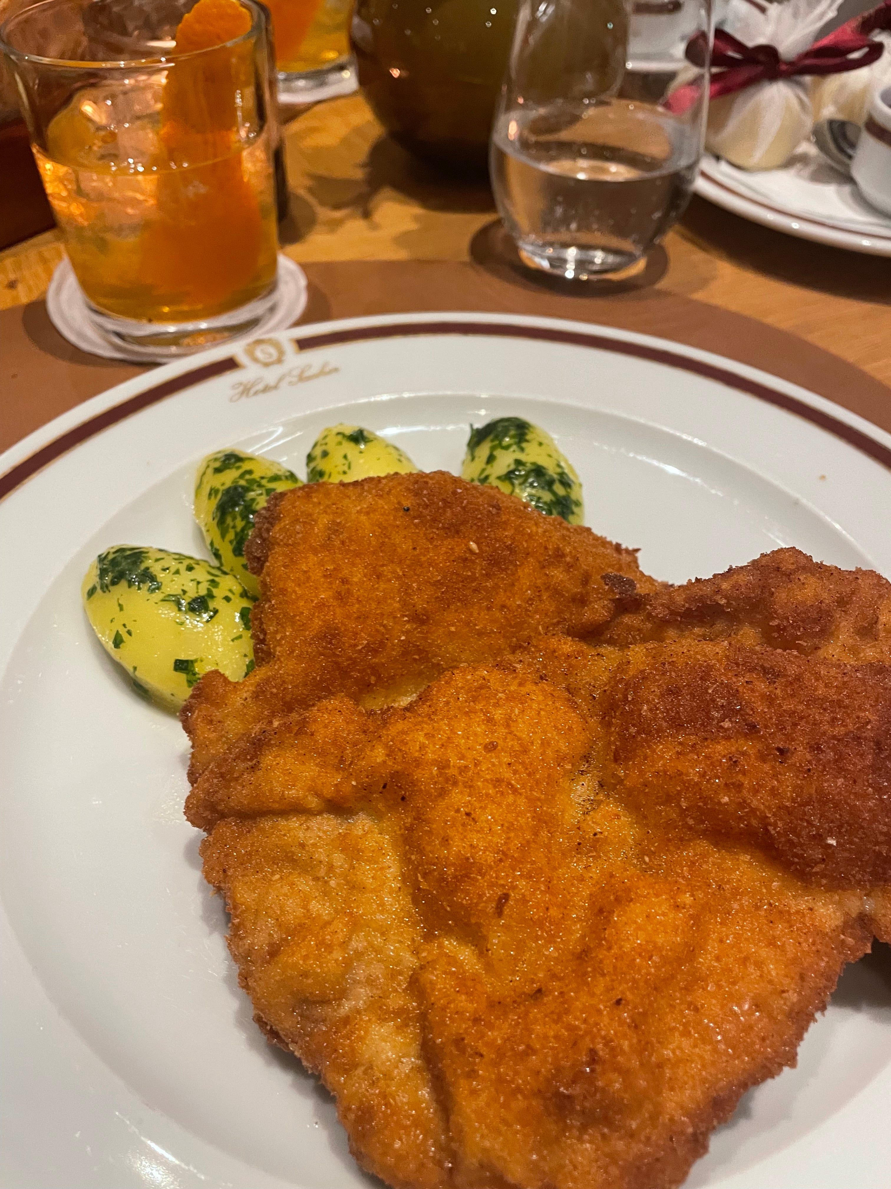 Sample traditional Austrian dishes such as the signature Wiener Schnitzel at Hotel Sacher Salzburg