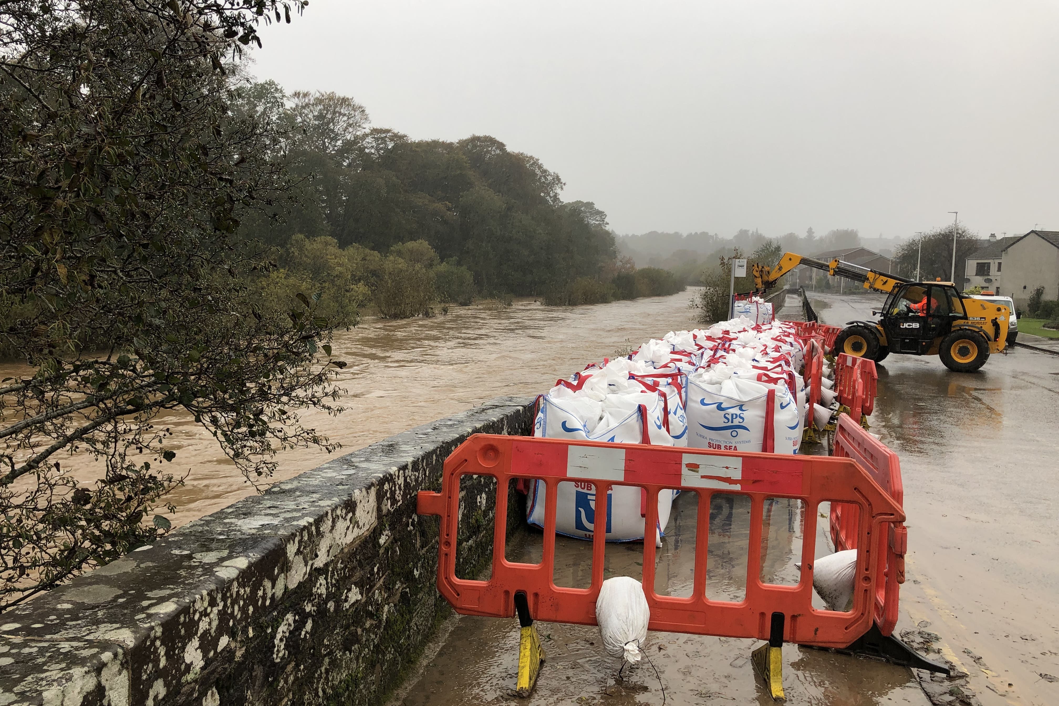 The bags were placed where a section of the river wall collapsed (Neil Pooran/PA)