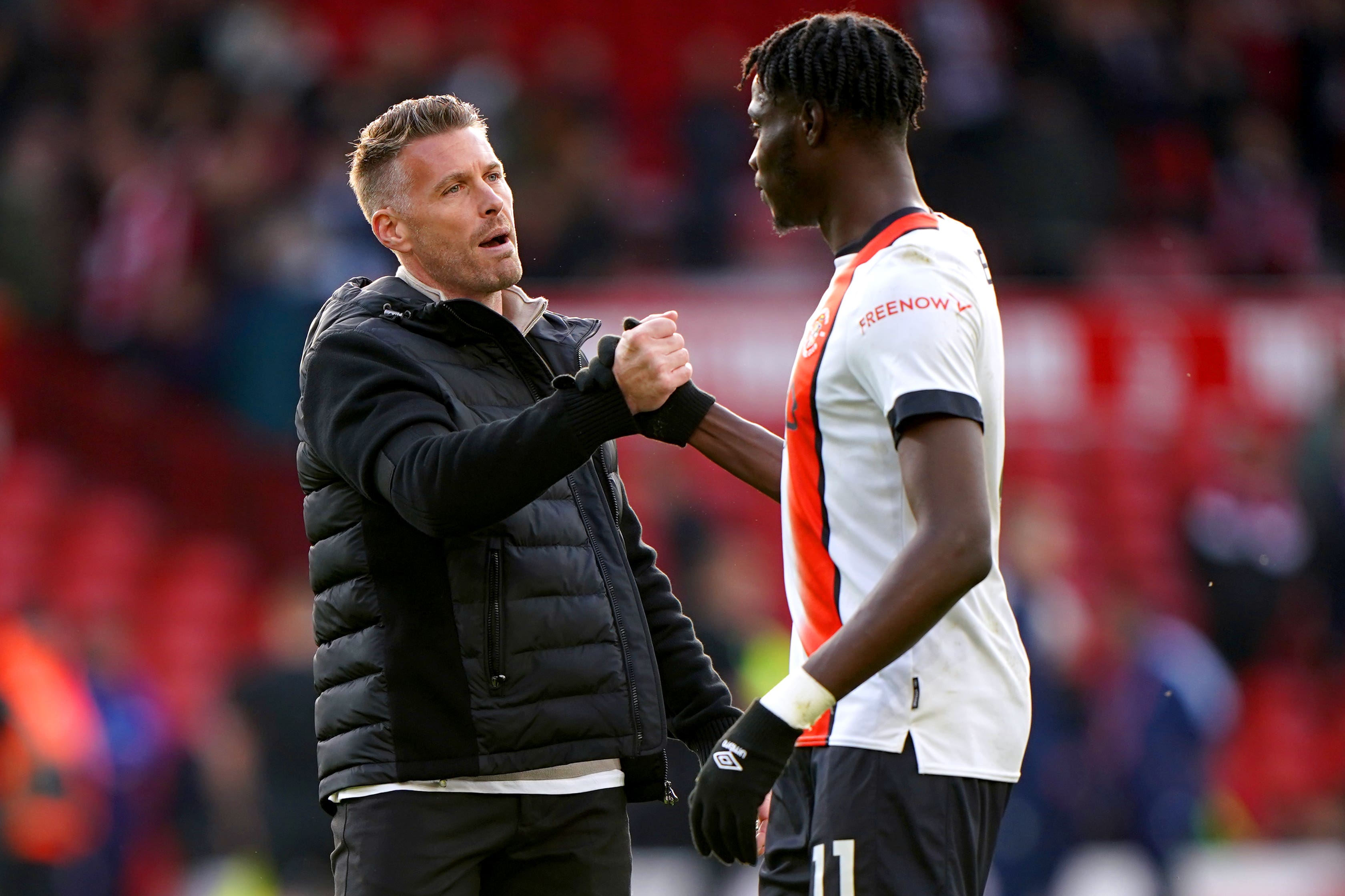 Rob Edwards speaks to Elijah Adebayo (Joe Giddens/PA)