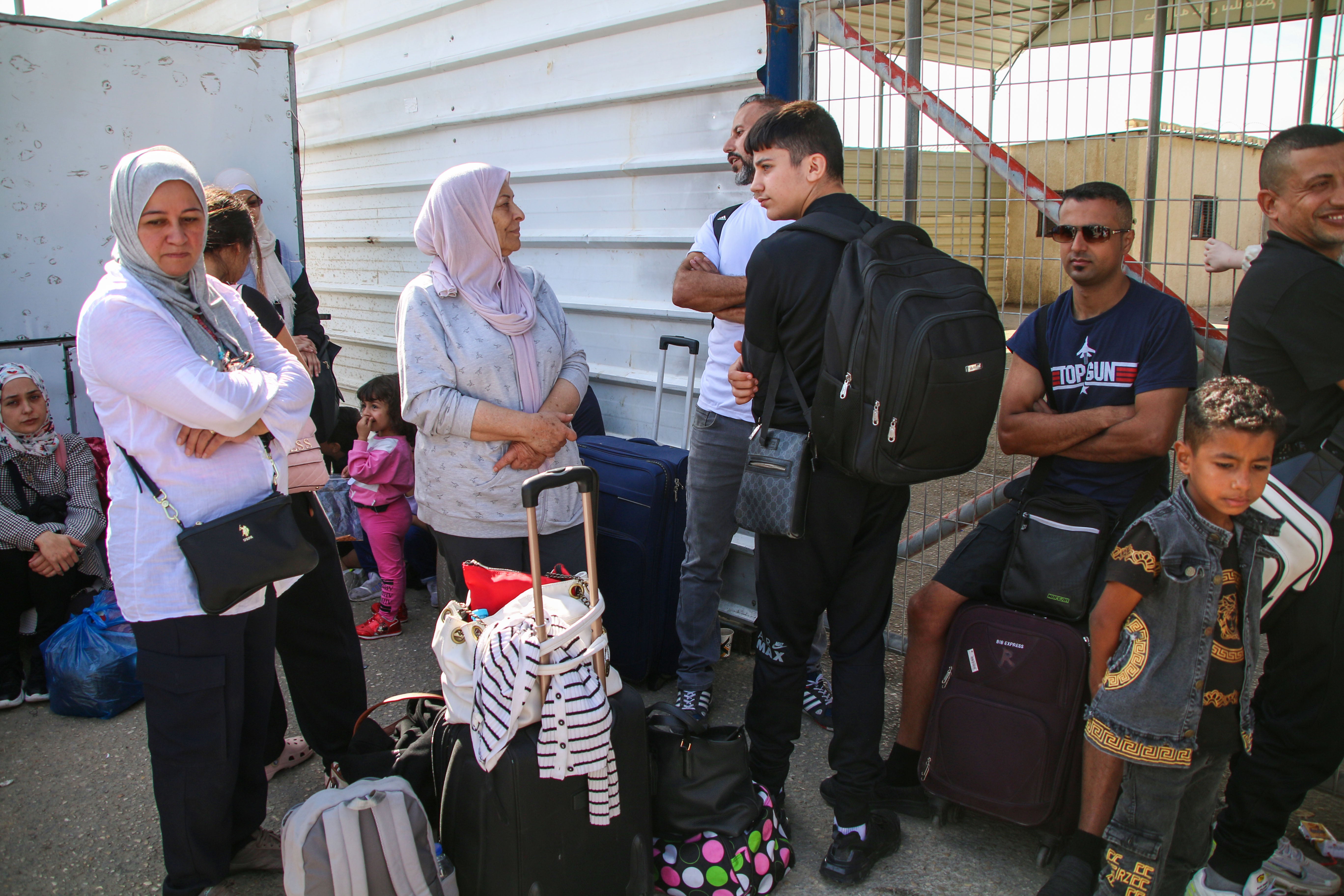 Foreign citizens wait at the Rafah crossing to be allowed to travel on October 21, 2023 in Rafah, Gaza