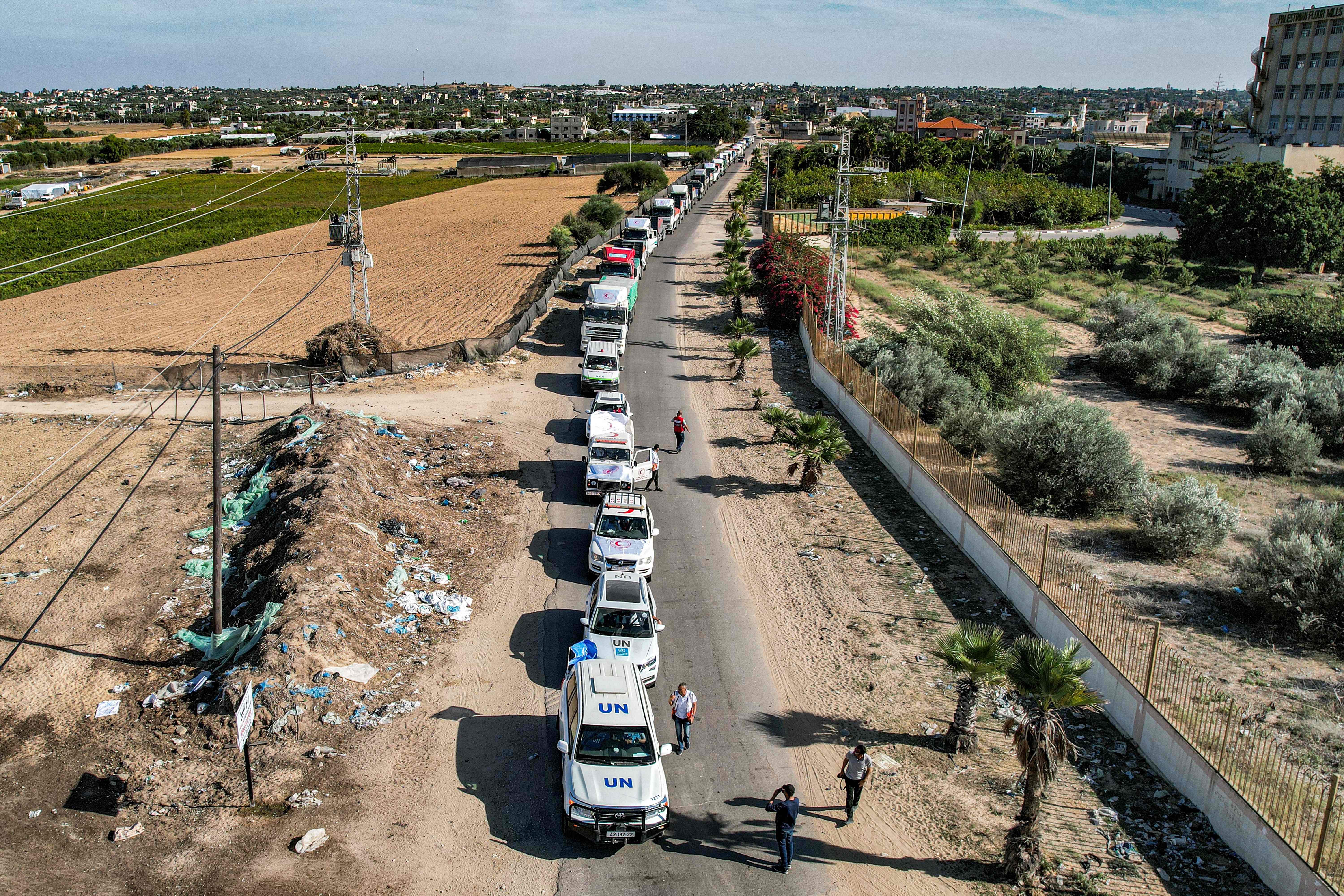 A convoy of humanitarian aid trucks arrives in Gaza via the Rafah border crossing through Egypt on 21 October