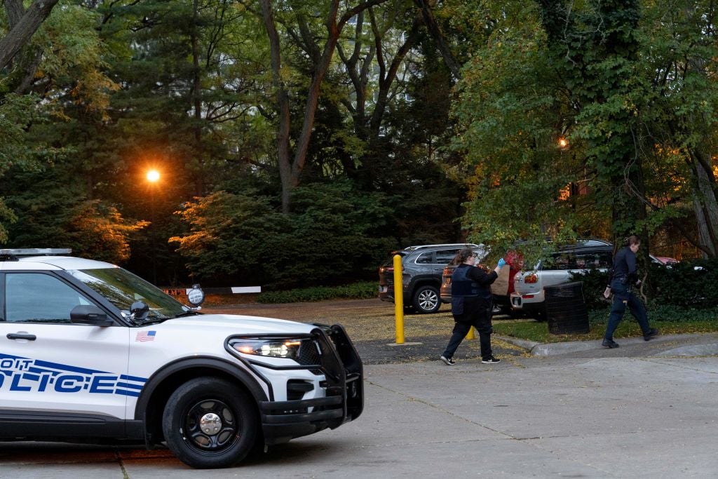 Detroit police officers work near the scene where Isaac Agree Downtown Synagogue president, Samantha Woll, was found dead