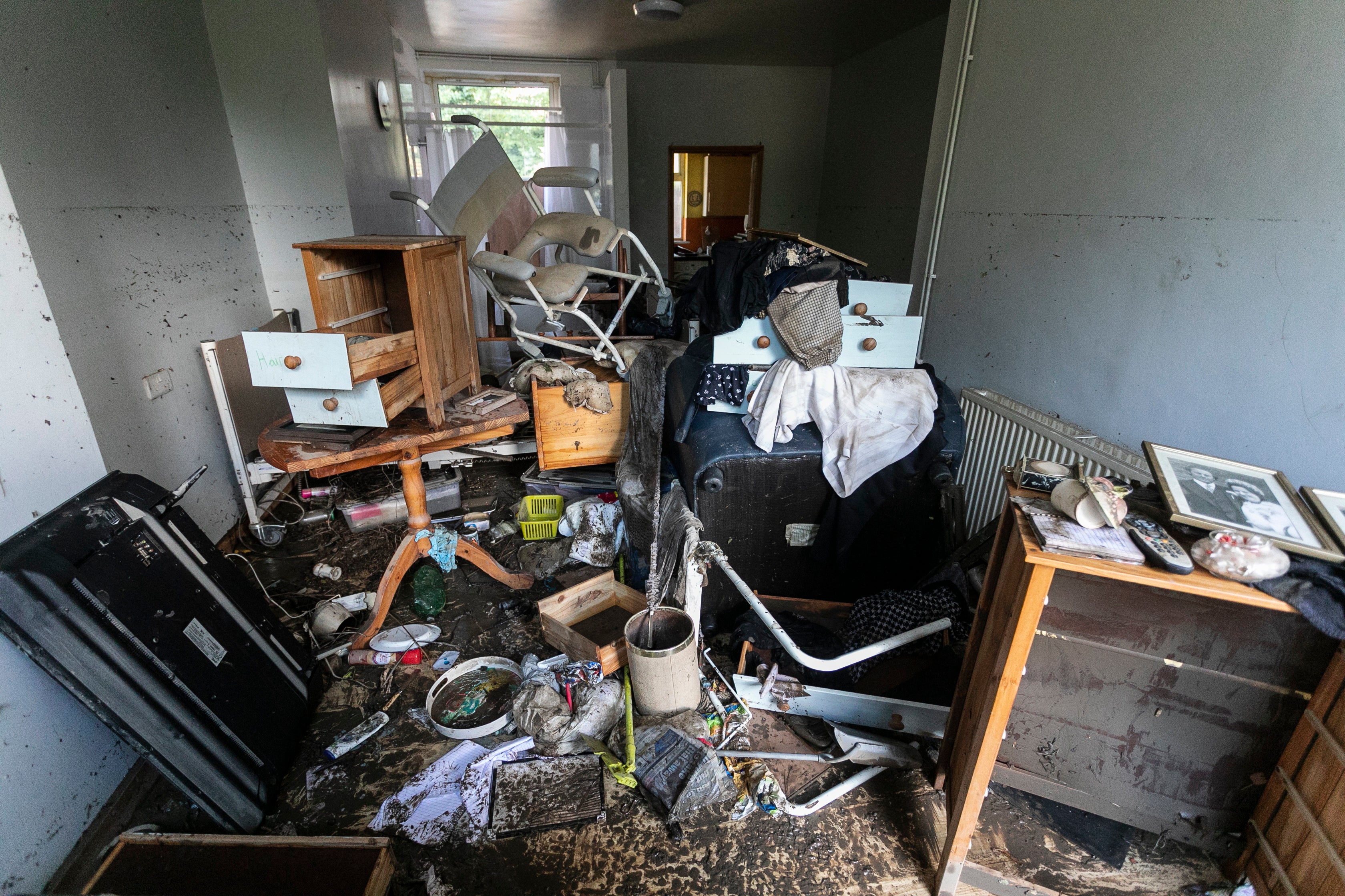 Flood high tide marks are seen over 5 foot high in the front room of Maureen Gilbert in Chesterfield