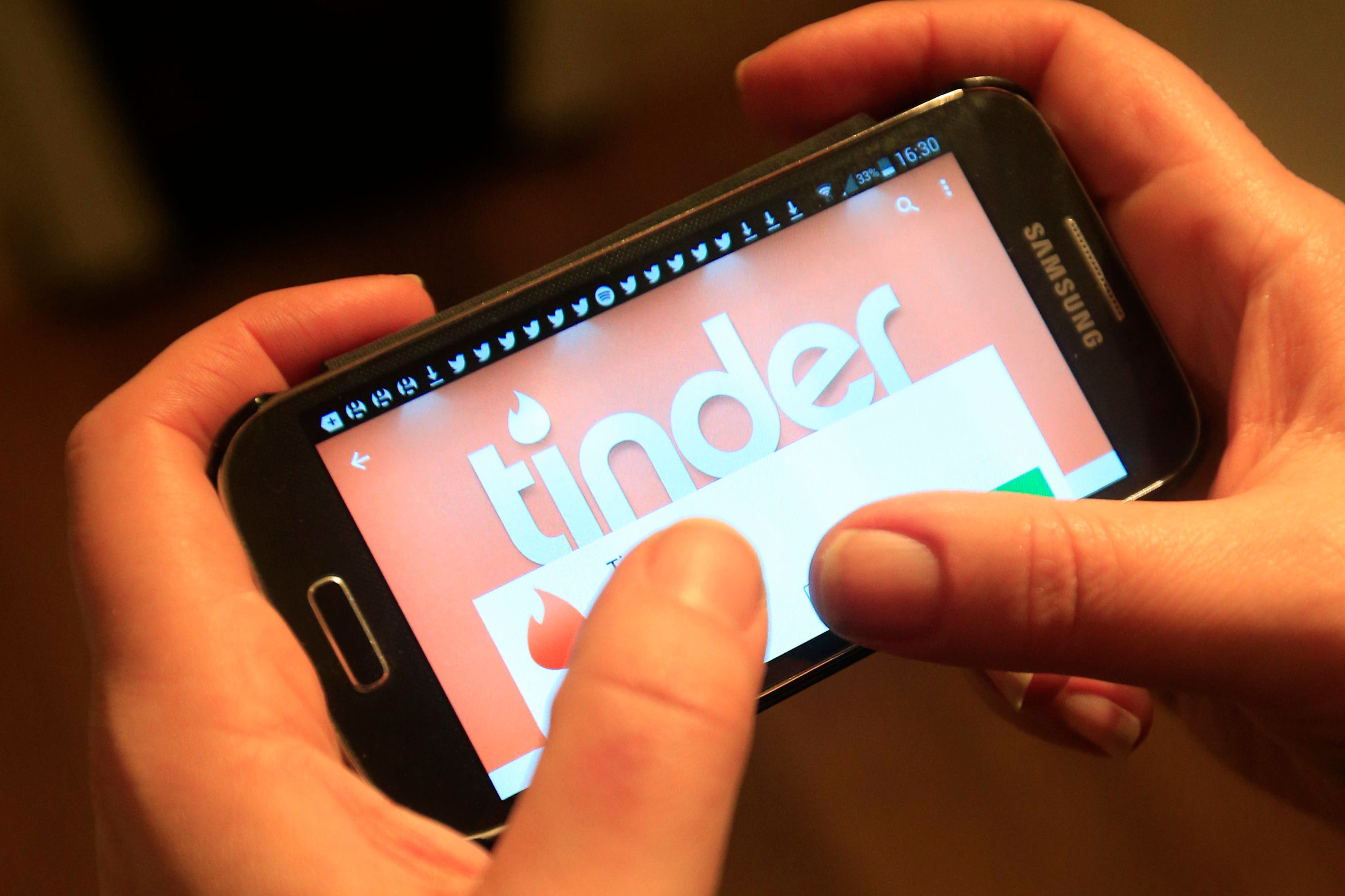 The Tinder app in use on a Samsung smartphone.