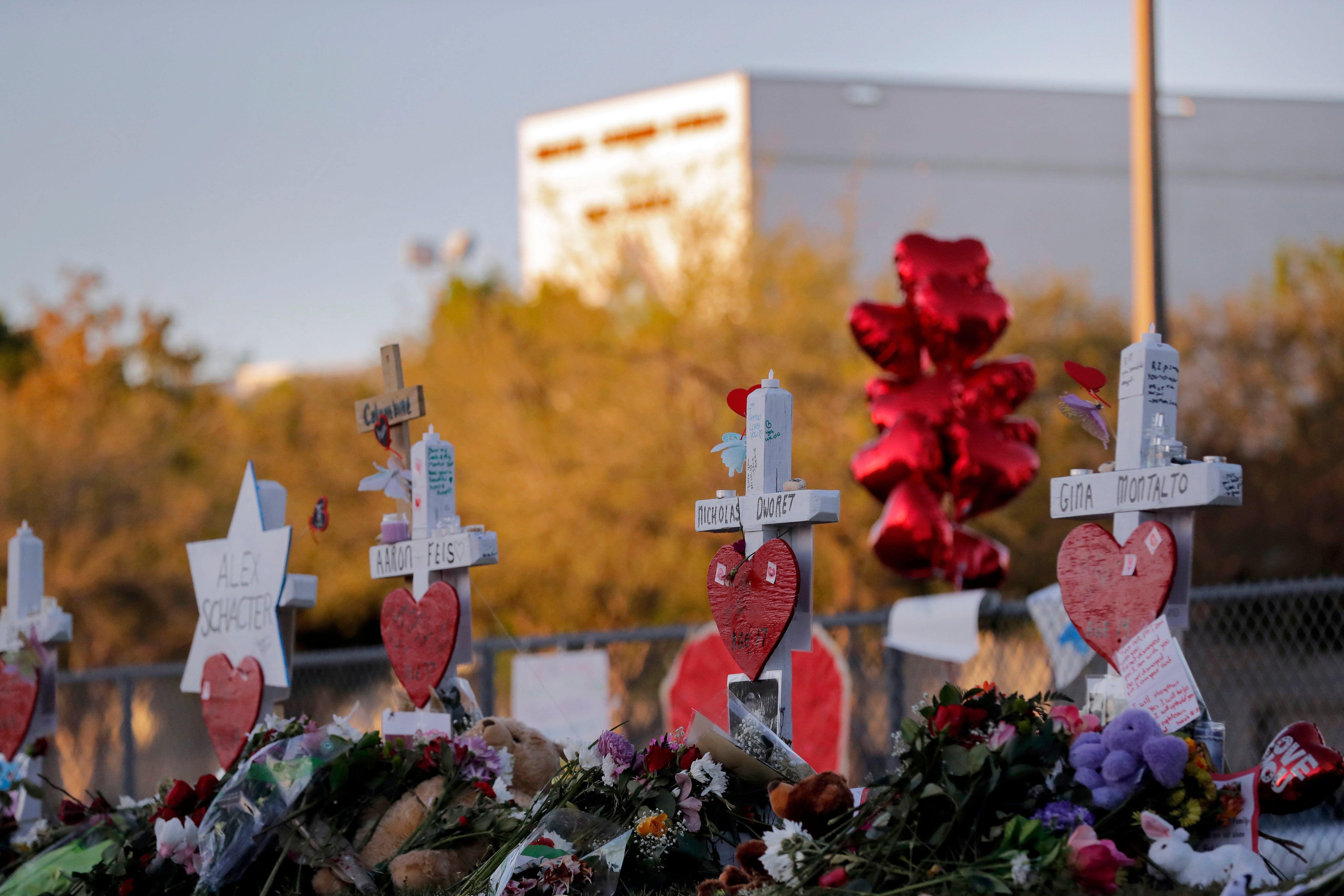 A memorial is made outside the Marjory Stoneman Douglas High School in Parkland, Florida