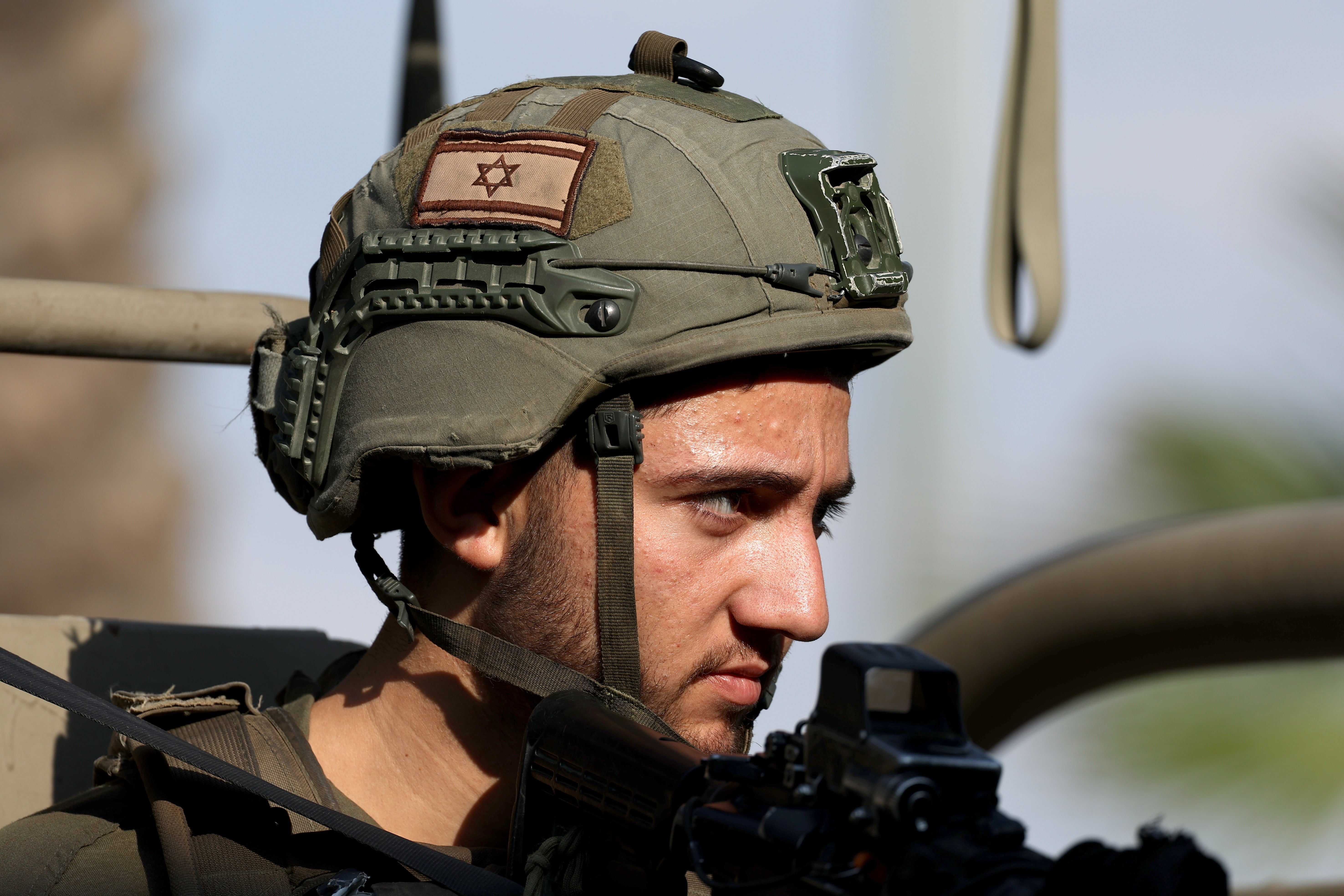 An Israeli soldier keeps watch at a position near the Israel-Gaza border