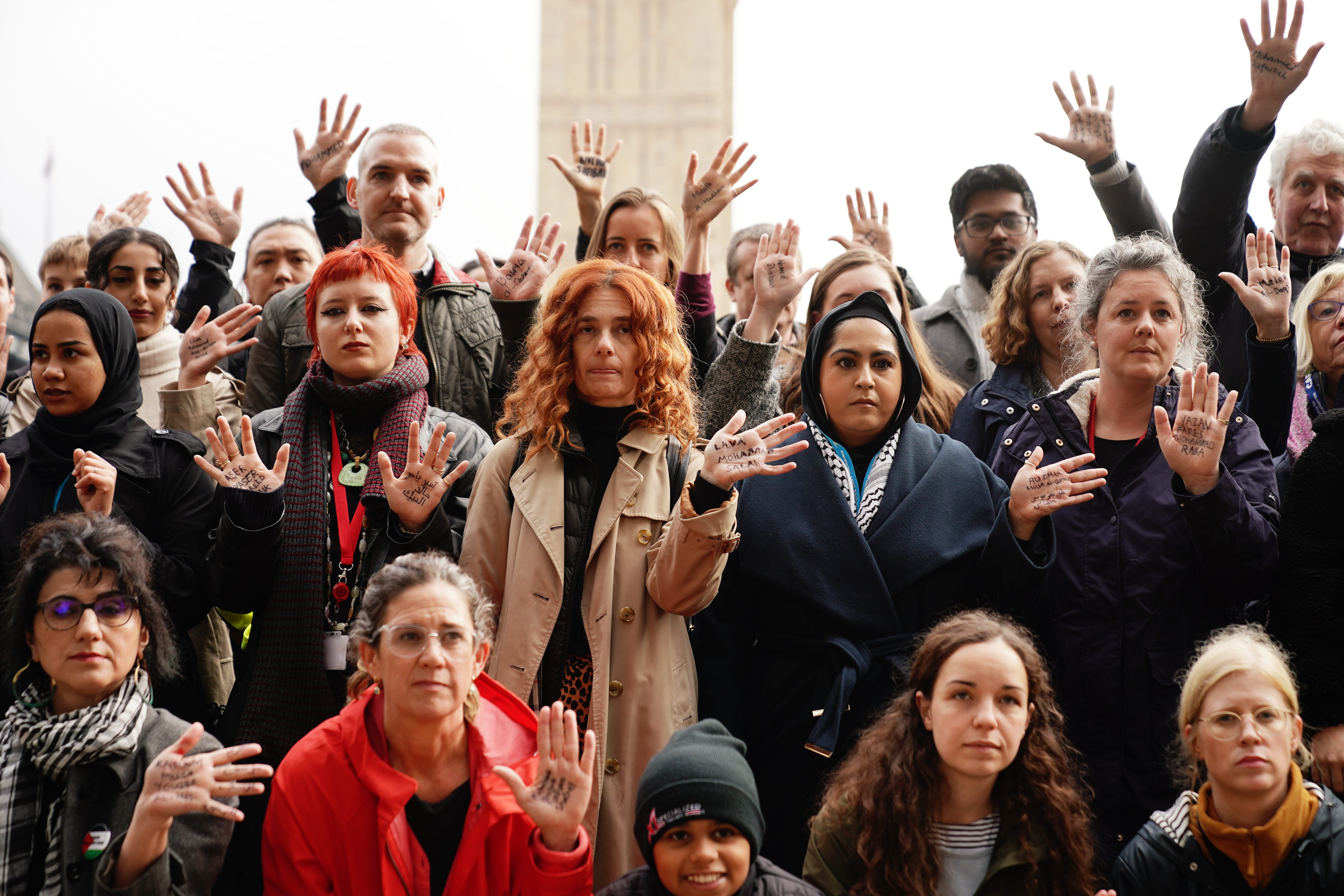 Attendees of the vigil had the names of children killed in Gaza written on their hands (Aaron Chown/PA)