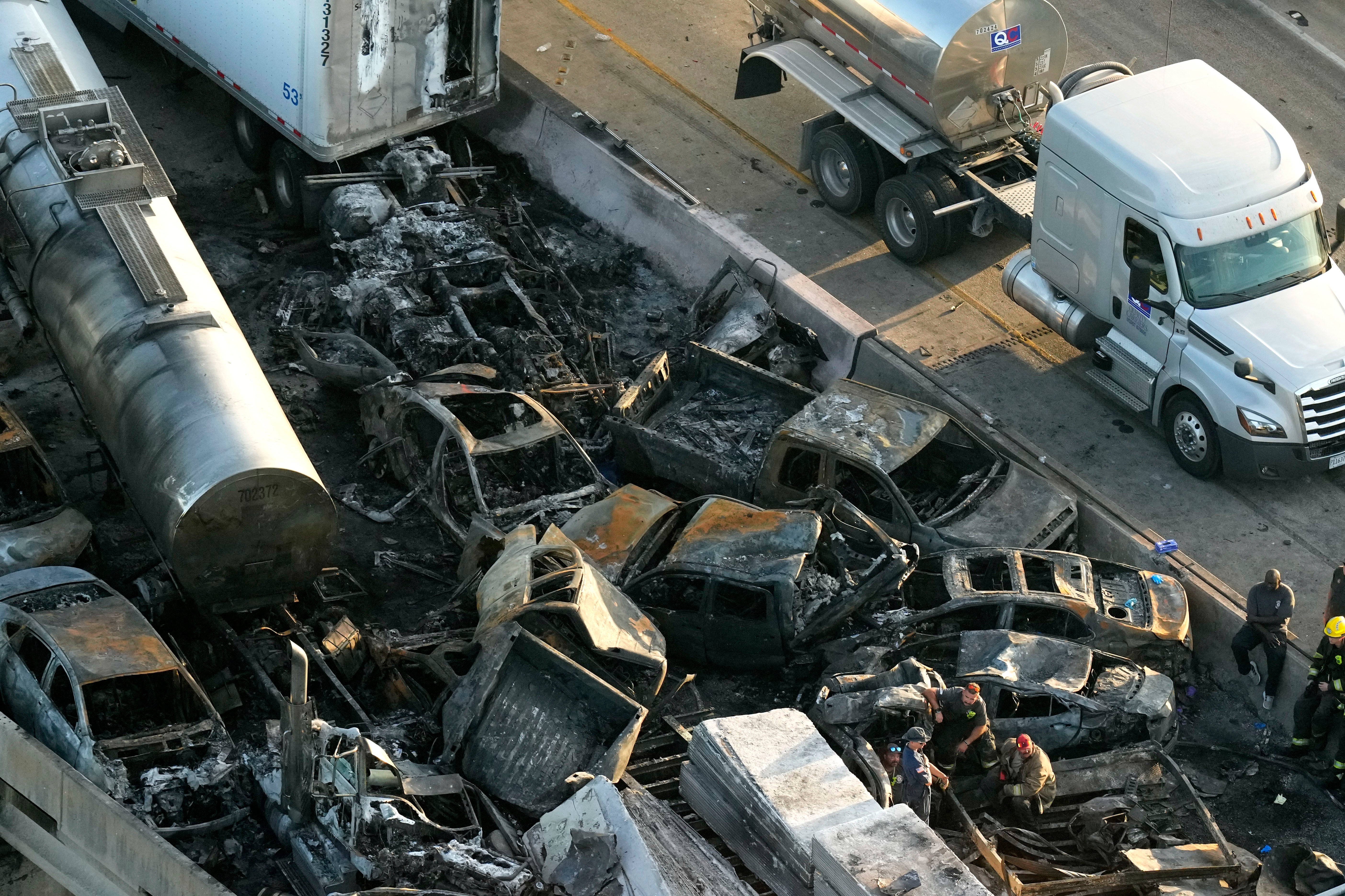 In this aerial photo, responders are seen near wreckage in the aftermath of a multi-vehicle pileup on I-55 in Manchac