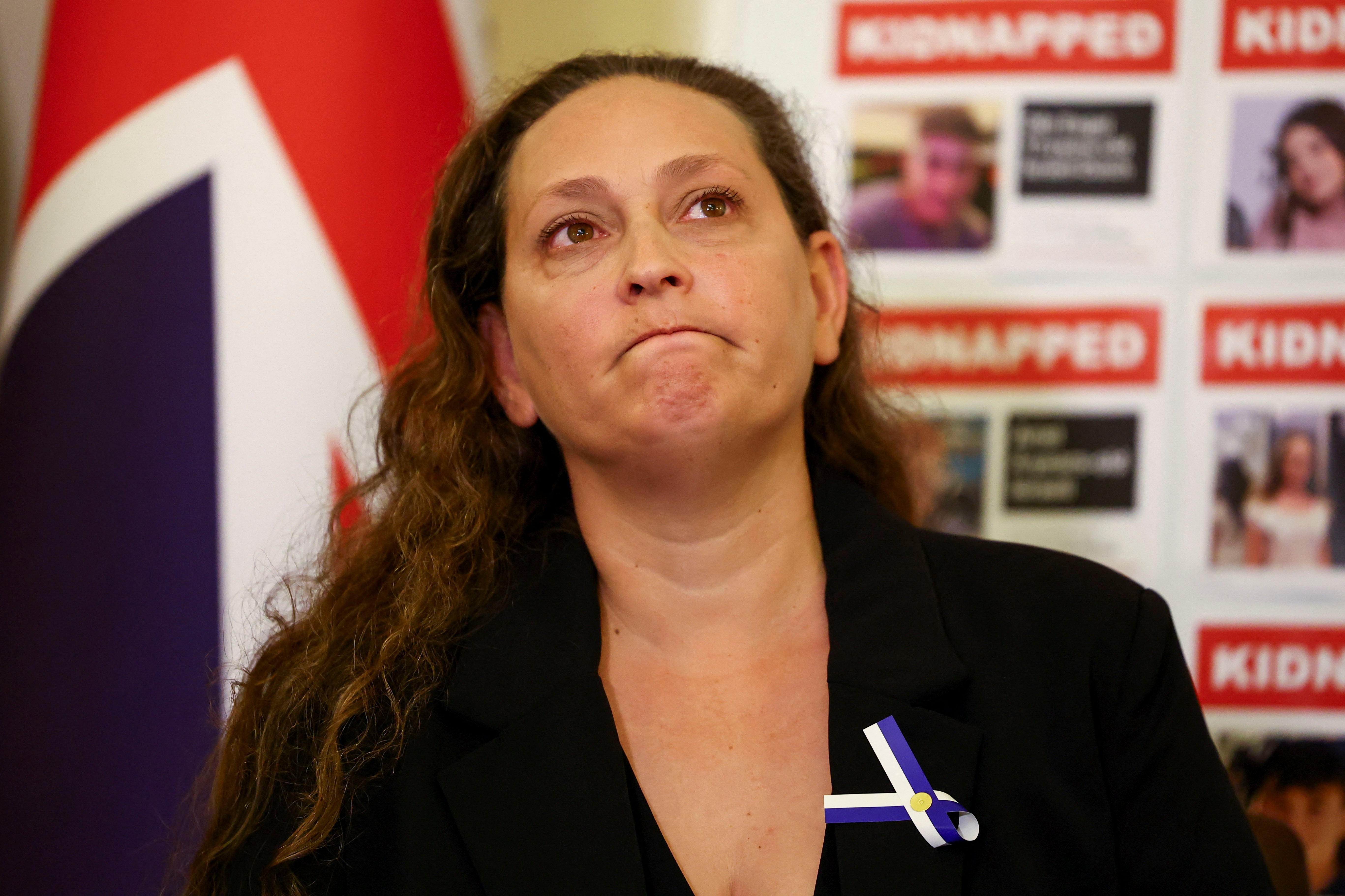 Family member of British-Israeli kidnap victims Ayelet Svatitzky reacts during a press conference