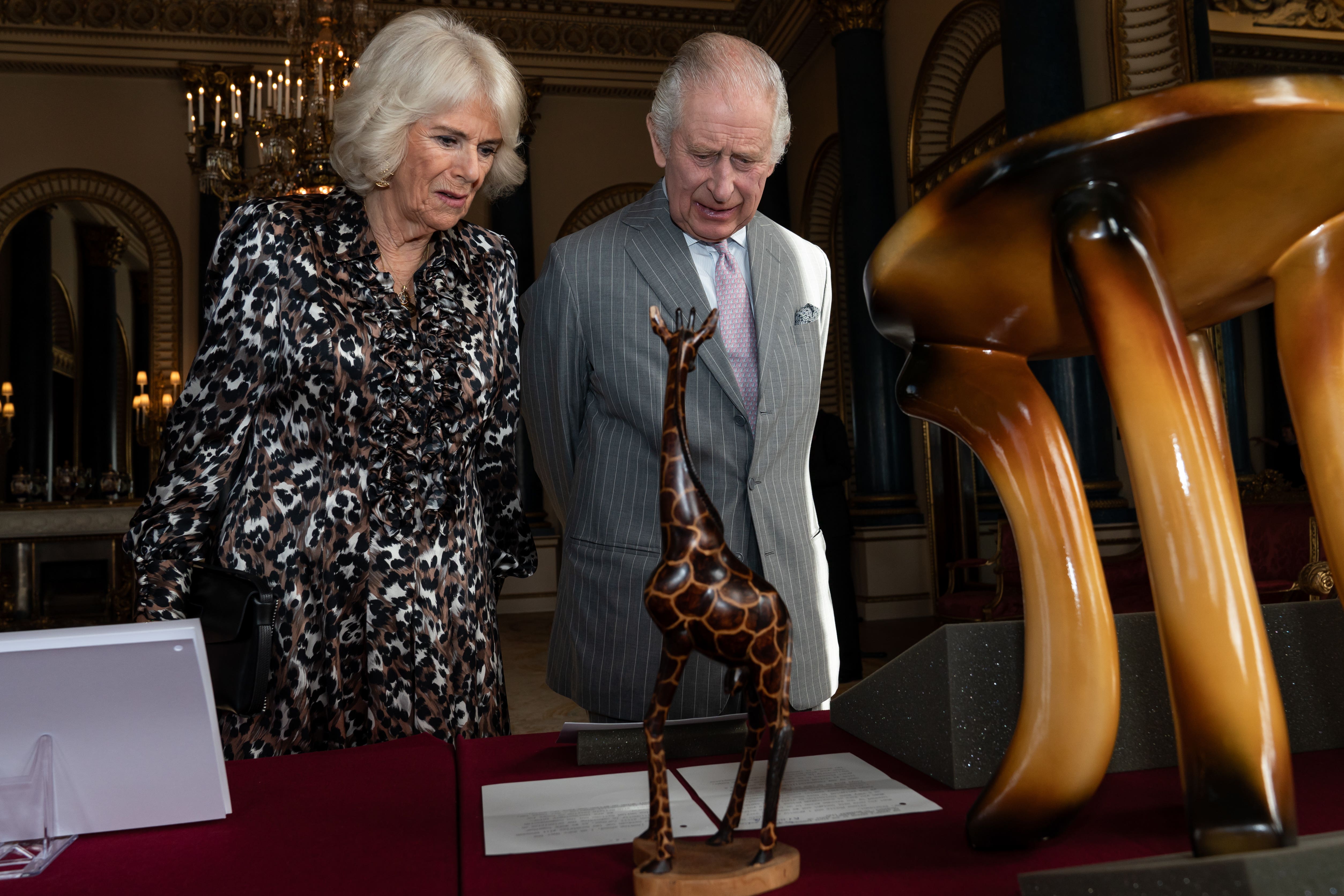 Charles and Camilla viewed part of the Royal Collection relating to the royal family’s connection to Kenya during the Buckingham Palace reception (Aaron Chown/PA)