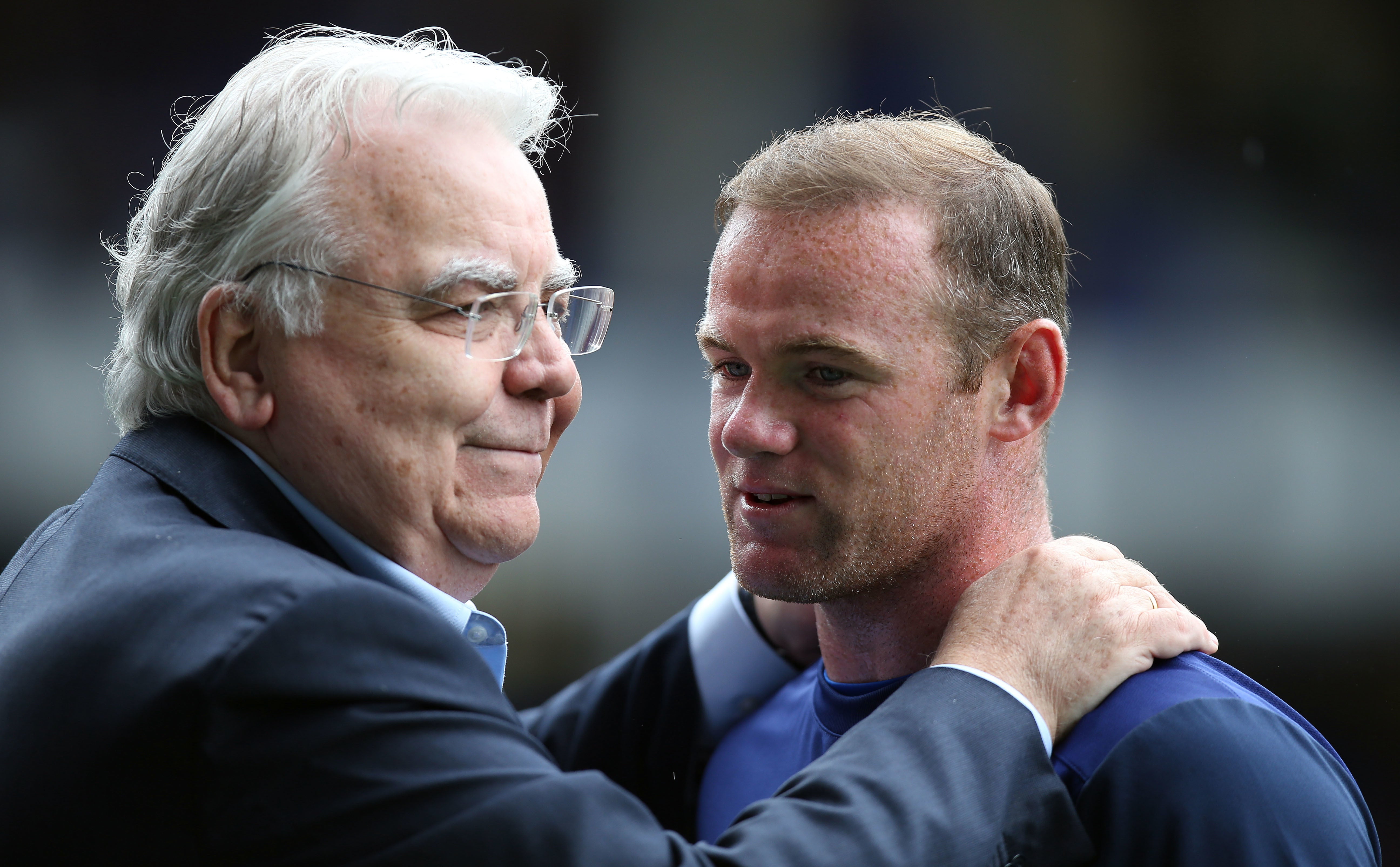 Bill Kenwright embracing Everton’s Wayne Rooney